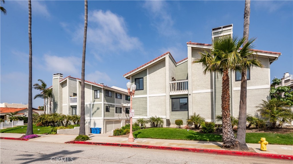 Catalina Avenue - just a short block from the beach! Discover this beautifully remodeled 3 bedroom, 2.5 bath front corner unit with oversized garage. The spacious living room has a fireplace and a private patio. The formal dining room leads to the gorgeous kitchen with sleek countertops, stainless appliances and the adjacent family room. A spacious primary suite is a luxurious retreat, and is joined by two other bedrooms and an additional remodeled bathroom. New doors and windows, new floors… what a great place to call home!