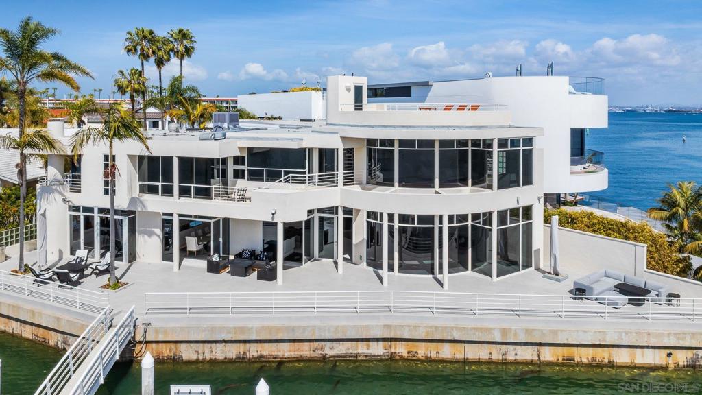 A ONE-OF-A-KIND OPPORTUNITY TO PURCHASE THE FINEST HOME IN THE BEST LOCATION IN THE CORONADO CAYS! Boasting over 11,000 square feet of wharfage! No less than four boat slips where you can park your large catamaran along with your yacht, speed boat and water toys. Approximately 132' of south facing waterfront with incredible panoramic bay, mountain and city views. Exclusive architecturally designed and impeccably updated. Kitchen remodeled with new high-end appliances. His and her bathrooms in primary bedroom. All ensuite bedrooms with balconies. New stone and engineered hardwood floors. New stone fireplace. Refurbished dock. New ACs. New roof gutters. LED lighting. Move in ready! Don't miss this once in a lifetime chance to own the most exquisite home on the water on San Diego Bay!