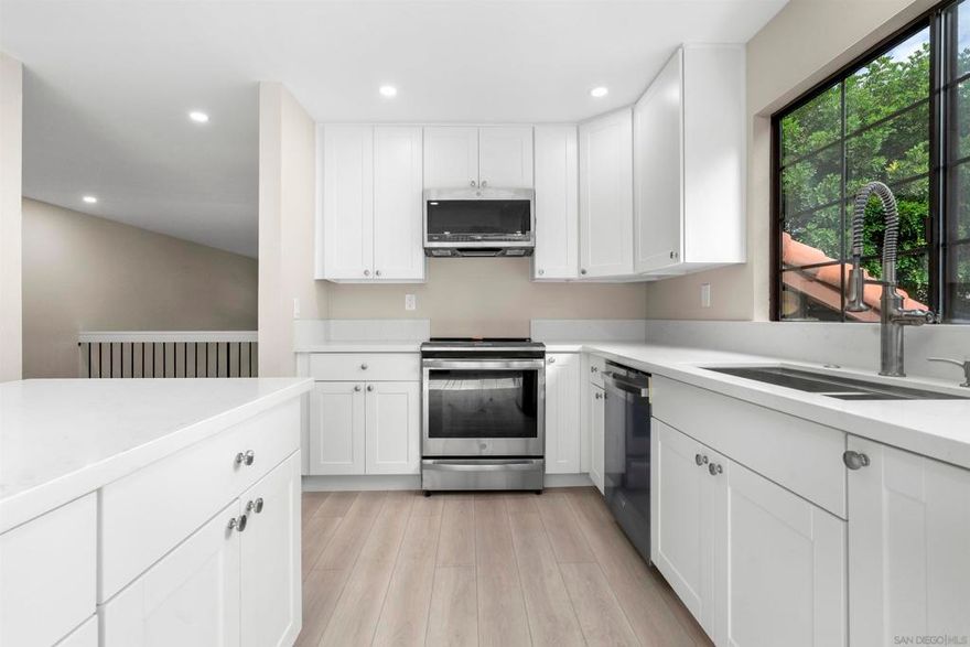 This beautifully remodeled, turnkey tri-level townhome offers every attention to detail in a highly desirable greenbelt setting within the coveted Mariposa community in Del Cerro. Spacious open floor plan at approximately 1,950 sq ft, with vaulted ceilings, fireplace, a stunning new kitchen, new flooring, cabinetry and baths. Lovely, private covered patio overlooking the beautifully maintained greenbelt and open spaces. The primary suite offers a walk-in closet, double vanity, and elegant en-suite bath. Additional highlights include direct access, spacious two-car garage into a versatile bonus space, perfect as a mudroom, storage area, or dedicated laundry room. The Mariposa community features a lovely pool and spa in garden setting with low HOA fees and a prime Del Cerro location near Mission Trails Park. A truly exceptional, immaculate home blending comfort, style, and convenience.  This beautifully remodeled, turnkey tri-level townhome offers every attention to detail in a highly desirable greenbelt setting within the coveted Mariposa community in Del Cerro. Spacious open floor plan at approximately 1,950 sq ft, with vaulted ceilings, fireplace, a stunning new kitchen, new flooring, cabinetry and baths. Lovely, private covered patio overlooking the beautifully maintained greenbelt and open spaces. The primary suite offers a walk-in closet, double vanity, and elegant en-suite bath. Additional highlights include direct access, spacious two-car garage into a versatile bonus space, perfect as a mudroom, storage area, or dedicated laundry room. The Mariposa community features a lovely pool and spa in garden setting with low HOA fees and a prime Del Cerro location near Mission Trails Park. A truly exceptional, immaculate home blending comfort, style, and convenience.