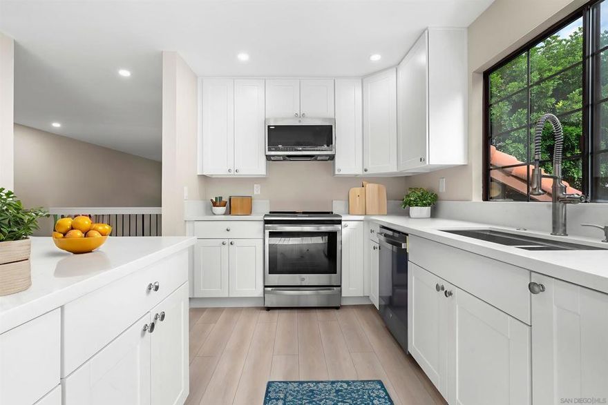 This beautifully remodeled, turnkey tri-level townhome offers every attention to detail in a highly desirable greenbelt setting within the coveted Mariposa community in Del Cerro. Spacious open floor plan at approximately 1,950 sq ft, with vaulted ceilings, fireplace, a stunning new kitchen, new flooring, cabinetry and baths. Lovely, private covered patio overlooking the beautifully maintained greenbelt and open spaces. The primary suite offers a walk-in closet, double vanity, and elegant en-suite bath. Additional highlights include direct access, spacious two-car garage into a versatile bonus space, perfect as a mudroom, storage area, or dedicated laundry room. The Mariposa community features a lovely pool and spa in garden setting with low HOA fees and a prime Del Cerro location near Mission Trails Park. A truly exceptional, immaculate home blending comfort, style, and convenience.  Please note: Images 25 through 32 are VIRTUALLY STAGED photos.