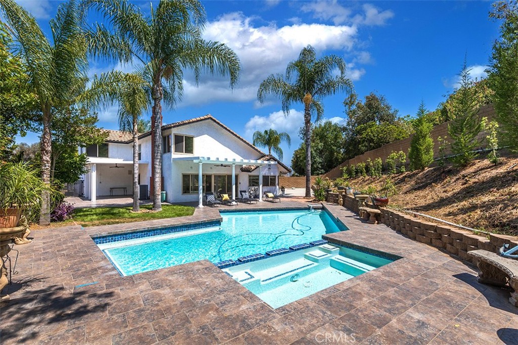 Welcome to your dream gated home with a long driveway in Diamond Bar hill community. This two story home with a 3-car garage offers a unique chance to embrace a sophisticated lifestyle in an unbeatable atmosphere. Step into a world of modern luxury as you explore this fully upgraded 4-bedroom, 3-baths & 3 car garages, 2307 sf home on a 14,372 sf lot size with view of fantastic new pool, spa & hill. The open layout welcomes you with new premium upgrades such as white vaulted ceiling with recessed lights in Living room, family room, kitchen and bedrooms, new carpeted staircase, and new tile in fireplace, Magnifica Era tile (24'x48'). This home has brand New vinyl plank floor throughout. New custom white paint in & out. This beautifully remodeled kitchen has new & elegant Calacatta quartz countertops and high-quality stainless-steel appliances like a new stove, range hood fan, dishwasher, garbage disposal & faucets. The kitchen opens to a charming dining area, creating a seamless flow for entertaining guests or enjoying intimate meals. The downstairs bedroom extends gracefully to your own big private patio. Another huge covered patio from the family room with a new ceiling fan for family gatherings. The perfect spot to relax and enjoy the picturesque views of hill and new blue tiled pool, spa & professional landscape with an auto sprinkler system. This creates a bright and inviting ambiance. The spacious master bedroom is a peaceful retreat, complete with large walk-in new shower (24x48' tile) is a sanctuary of comfort and hallway bath has a new pristine tub with shower & fixtures. This home has a brand new central air, New pool equipment( less on electricity consumption),good horsepower and new electric meter box. You can park 8 cars in the driveway with a three car garage & RV access(any size you can park). Embrace the perfect blend of tranquility and convenience, as this exceptional property is ideally situated top of the hill in a cul de sac, near shops, restaurants, and easy access to the freeway. Your dream home awaits you at 1250 Kinglake, Diamond Bar. Fumigation was done in November & all the dry rot has been taken care of. Act fast and make it yours today!