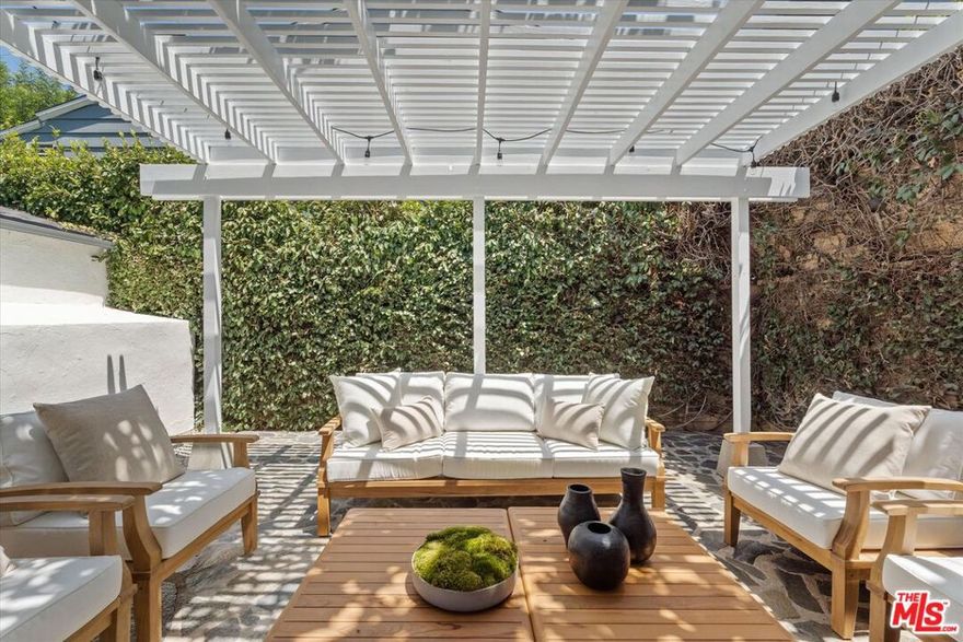 " Le Cottage "  Tucked behind lush privacy hedges on a prime corner lot in the heart of West Hollywood, 560 N Croft Ave blends timeless charm with thoughtful modern updates. This 4-bed, 2-bath home features an updated kitchen with brand-new stainless steel appliances, a formal dining room, a cozy breakfast nook, and abundant natural light throughout. The detached two-car garage comes equipped with EV charging, while the private yard offers a serene escape. All of this is just steps from Melrose Place and its iconic cafs, restaurants, and boutiques, including Alfred Coffee, Catch LA, and EP & LP. FIREPLACES ARE DECORATIVE ONLY .