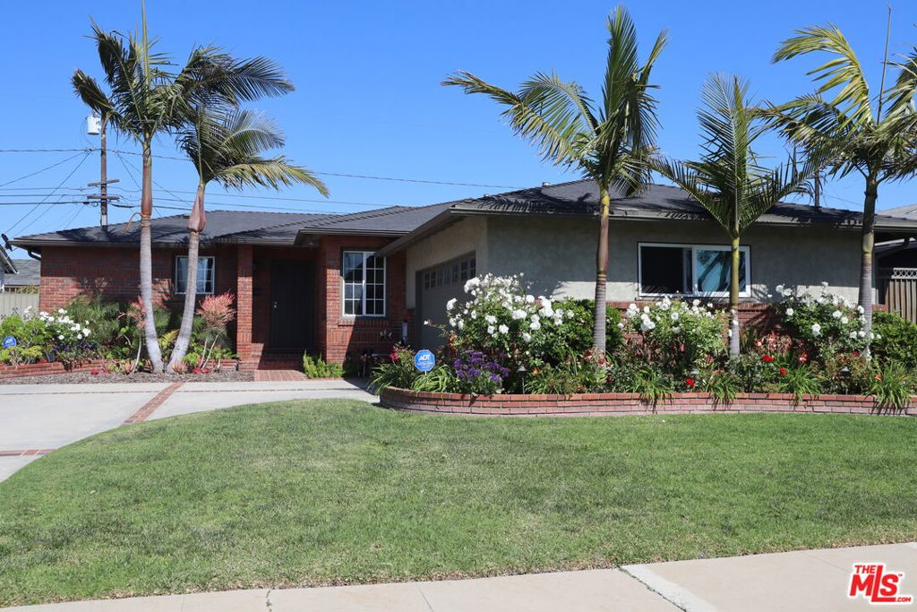 Tucked away on a peaceful street in one of Gardena's most charming neighborhoods, this upgraded, spacious, and meticulously maintained home offers 4 bedrooms and 2 bathrooms, plus a finished garage currently used as a studio/guest space (potential 5th bedroom). Wired w a new 200 amp panel (fully permitted) to easily power the hard wired hot tub, EV charger, and a 230-volt mini-split A/C recently added to the garage, which also includes a built-in Murphy bed and large prof. sound-proofed window. The kitchen boasts a sparkling stainless fridge, 6 burner Viking stove, and abundant cabinet storage. Unwind or entertain in your private backyard retreat with a new hot tub & fire pit, surrounded by the BEST neighbors :) and total seclusion. The very oversized 4th bedroom has a newer wood burning FP & can easily serve as a recreation room. The fully automated irrigation system takes care of an amazing garden, easily the best in the neighborhood. Shows VERY well!! Easy to show.