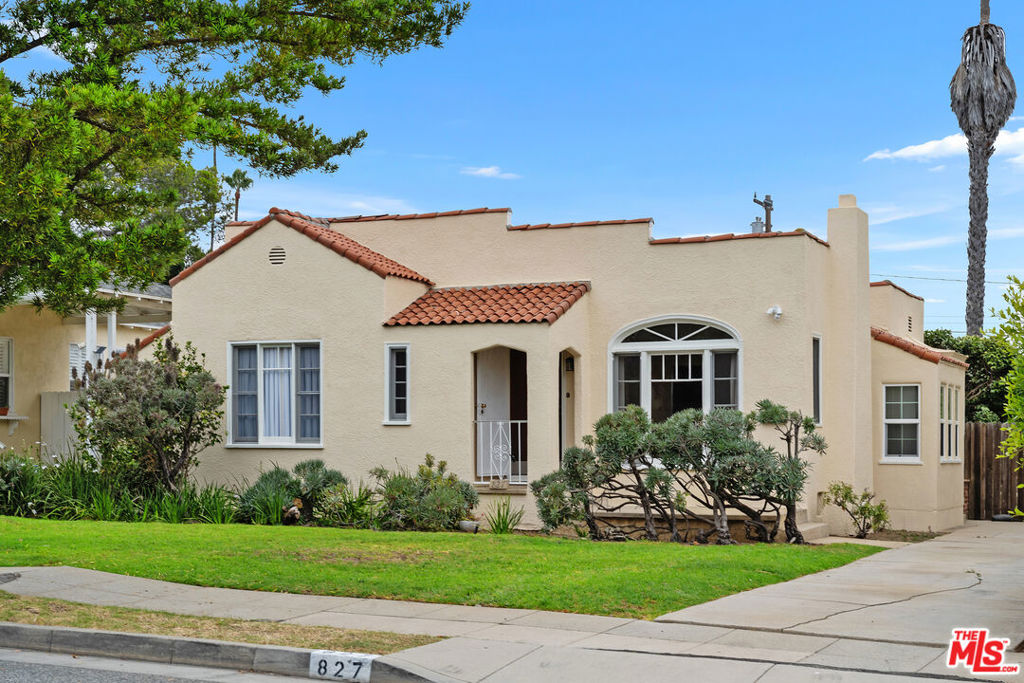 Inside this classic Spanish bungalow is an almost completely renovated oasis. Step into this welcoming space, with plentiful natural light streaming in through the large windows, featuring new wide-planked laminate hardwood floors, new paint, new electrical panel, and recessed lighting. The layout features an open living area, as well as a delineated space perfect for a private work area, exercise room, or play space. The cook's kitchen, with stone countertops and stainless-steel appliances, flows seamlessly into a cozy formal dining room with additional storage. Each of the two bedrooms showcases modern comfort, including a new A/C unit and closet with custom built-ins. The backyard, with one side of mature hedges and the other an extended pop of brilliant bougainvillea, is the perfect backdrop for summer picnics and the best of outdoor living. The detached garage space (no vehicle access) includes new washer/dryer hookups, and additional storage. Private driveway will accommodate at least two cars. Located in a desirable neighborhood just south of Montana Ave, you are minutes away from the best of Santa Monica's shopping and dining.
