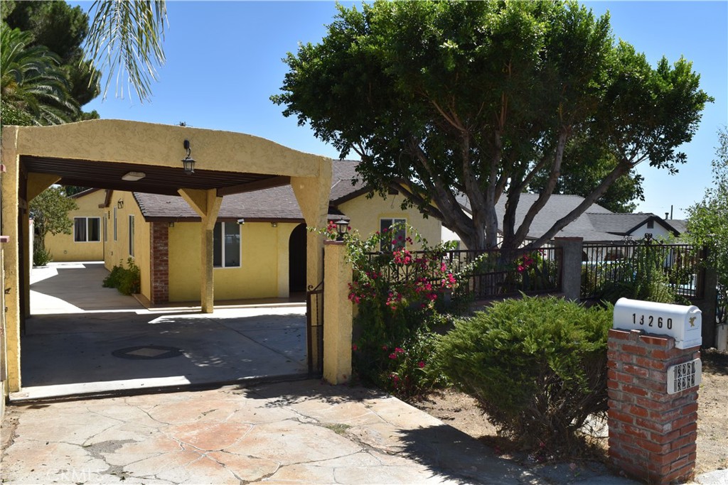 Two homes on one lot! 3 bed + 2 bath Main dwelling (13260) and a 1 bed + 1 bath detached ADU (13262) makes this a great opportunity to live in one and rent the other or for 2 families to occupy both units in this quiet residential neighborhood. This gated property is accessed both from Raven St. and the rear alleyway via a metal gate. It's situated in a residential neighborhood in close proximity to Veterans Park and Mission College. The newly added on-to and renovated house has central air and heating, a new kitchen with gas stove and hood, plus a built in dishwasher. The detached garage was converted to an ADU (permitted) with a kitchenette, living room, bedroom with sliding glass door to the rear patio and a full bathroom. The lot has multiple fruit trees, including an avocado tree. There is an additional attached half bath that is accessed from the rear patio outside the bedroom sliding glass door. The roof of the house and ADU have been recently partially redone in areas that needed it. The long driveway in the front has more than enough space for multiple cars, along with a carport.