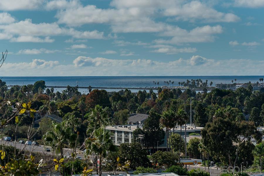 Ocean Views - Remodeled almost 1,200 sq ft. Large 2bed/2ba. See the fireworks in upstairs corner prime location! Custom newer kitchen and bathrooms, triple pane, black trimmed window. Bright, spacious, one-of-a-kind property. Floor-to-ceiling slate fireplace set with custom built-ins for entertainment/décor. This home hosts plenty of storage, fantastic natural sunlight. Open layout, W/D and balcony. Pool and Spa, 2 assigned covered parking spaces. Pets neg. Close to grocery, gym, coffee and restaurants and other shopping.