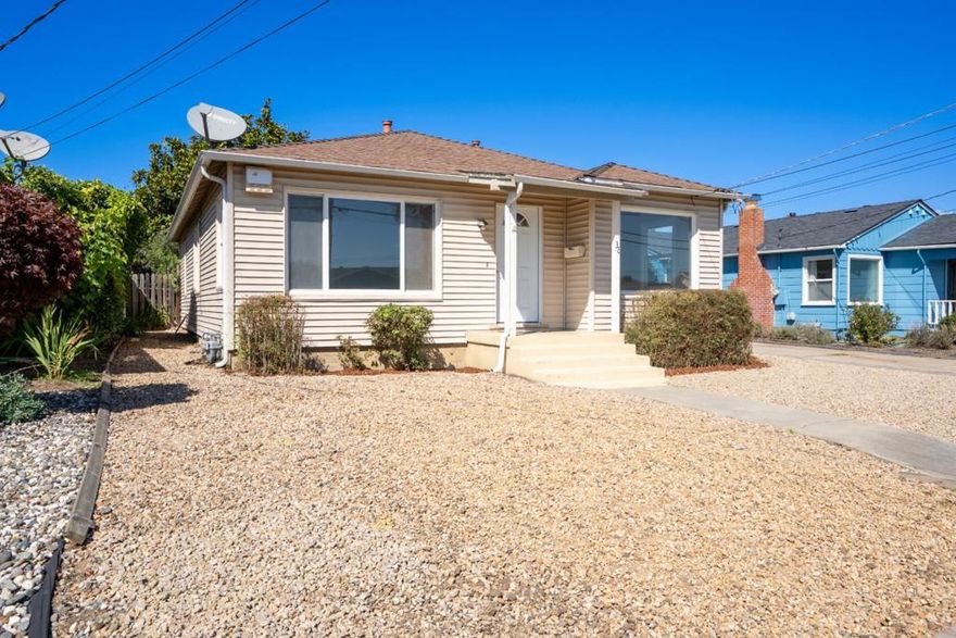 Welcome to this inviting bungalow-style single-family home, centrally located in the vibrant community of Watsonville. Offering approximately 1,168 square feet of comfortable living space, this home features a spacious living room filled with natural light, three generously sized bedrooms, and one and a half bathrooms. The kitchen opens to a cozy dining area and boasts ample countertop space, generous cabinet space, and a built-in microwave, perfect for everyday living and entertaining. Recent interior updates include fresh paint and new carpeting, giving the home a clean, move-in-ready feel. Step outside to a large backyard with plenty of room for gardening, play, or relaxing, ideal for enjoying Watsonville's mild climate. Don't miss this opportunity to own a well-maintained home in a convenient location, close to schools, parks, and shopping.