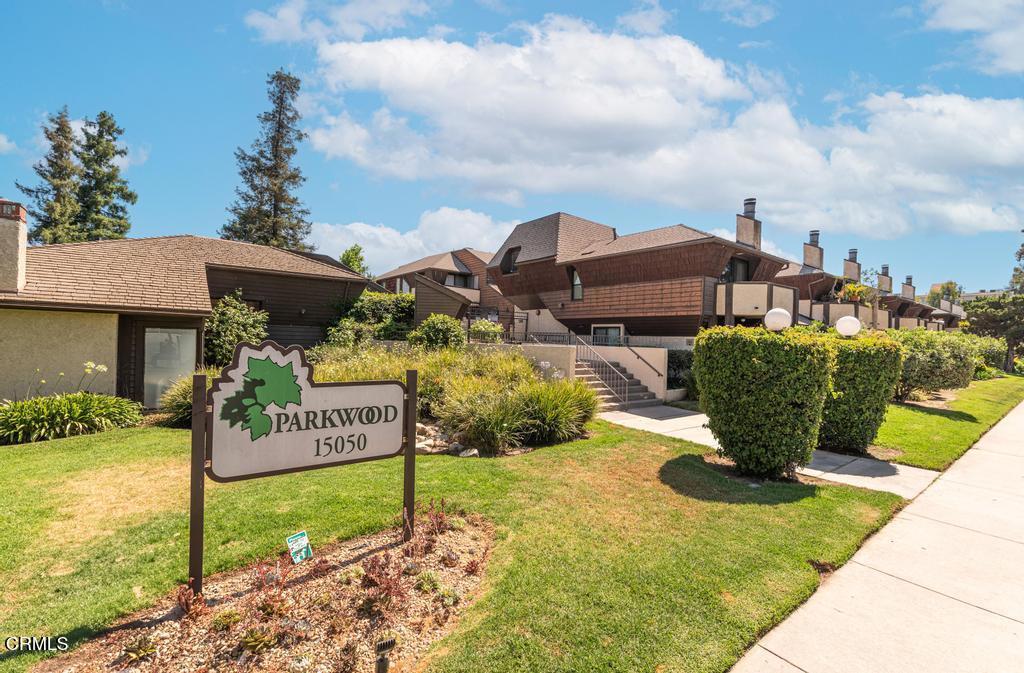Welcome to the Parkwood, a beautifully maintained, gated community nestled in the heart of Van Nuys. This serene complex is rich with amenities, including lush landscaped grounds, sparkling pool, 2 spas, sauna, fully equipped gym, and recreation room.Step inside the expansive 2 bedroom, 2 bathroom condo offering over 1300 square feet of comfortable living space. This end unit is quiet and only shares one common wall. The inviting layout features soaring ceilings, recessed lighting, tile and laminate flooring throughout, generous storage, and a cozy fireplace in the family room--perfect for relaxing evenings. Well appointed kitchen with plenty of storage in the modern shaker cabinets with quartz countertops and a breakfast bar. A convenient laundry closet with built-in cabinets is located just off the kitchen. A covered patio just off of the dining area is perfect for alfresco dining. Upstairs, two spacious bedrooms with their own bathrooms on separate levels for privacy. The primary bedroom has a large balcony, ideal for a morning coffee or evening unwind. The home also includes two assigned parking spaces in the secure community garage, additional private large storage room, and access to an EV charging station.Centrally located near markets, parks, restaurants, and freeways. This home also is FHA and VA approved and qualifies for other great buyer loan programs .