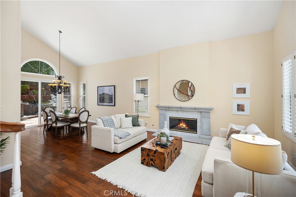 DISCOVER YOUR SANCTUARY IN THE PRESTIGIOUS CANYON CREST COMMUNITY.
Embrace an unparalleled lifestyle in this exquisite five-bedroom, four-bath residence, perfectly positioned on one of the largest and most private lots within the coveted Canyon Crest community. Situated at the end of a cul-de-sac, this home offers a truly unique indoor-outdoor living experience on a sprawling 9,139 square-foot lot. As you step through the double doors, you are welcomed by a grand living & dining room, where soaring vaulted ceilings & rich hardwood floors create an immediate sense of elegance, an inviting atmosphere with natural light flooding the rooms.
The heart of the home is a chef's dream. The gourmet kitchen features granite countertops, a large center island, built in Monogram refrigerator & brand new double oven. A charming breakfast nook, substantial walk-in pantry & a built-in desk area provide both storage & functional workspace. The big family room flows effortlessly into a 478-square-foot recreation room, a versatile space perfect for a game of billiards, table tennis, or a lively children's playroom.
Retreat to your private sanctuary in the master suite with an attached retreat or office provides a quiet space for relaxation or work. Thoughtful modifications include an ADA-compliant downstairs bedroom & bath, bonus room has been expertly enclosed to serve as the fifth bedroom.
The magic of this home extends to its resort-like backyard, an oasis designed for entertaining & tranquil escapes. A built-in BBQ and ample patio space make hosting a delight, while a charming treehouse area offers peaceful Zen corner. The opposite side of the yard captivates with a waterfall cascading among lush, mature palm trees, a custom fire pit for cozy evenings. This home is replete with desirable features, including elegant plantation shutters, three fireplaces, re-piping, a whole-house water softener, & brand-new garage doors.
Beyond your private estate, the Canyon Crest lifestyle awaits. The community's multi-million-dollar recreational facility offers resort-style amenities, including two swimming pools, a spa, a baby pool, a fully equipped gym, tennis & pickleball courts. The magnificent Lake Mission Viejo is just a short distance away, offering year-round activities like boating, fishing, and swimming, along with a spectacular Fourth of July fireworks show. This is more than just a home; it's a gateway to a joyful and enriching life for the entire family.