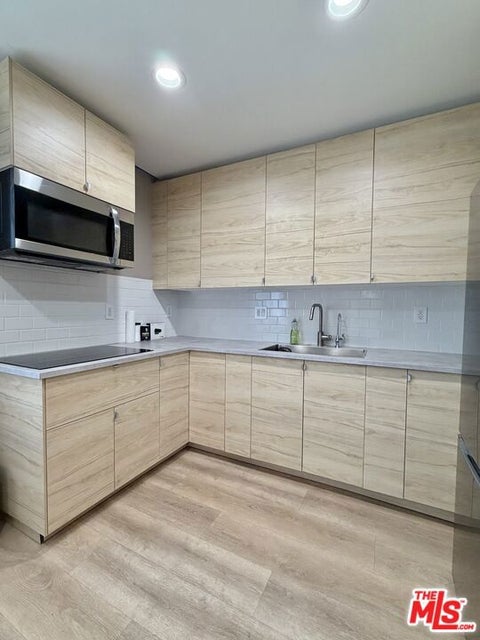 Photo of 15846 Kalisher Street, Granada Hills, CA 91344 (MLS # 26837019)