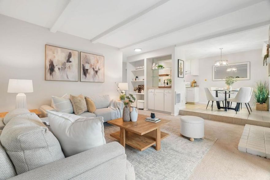 This light-filled 2-bedroom, 2-bath top-floor condo is nestled in the community's interior, offering a quiet retreat surrounded by lush landscaping, gentle fountains, and beautifully tended walkways. Inside, the open living area welcomes you with a cozy fireplace and sliding glass doors that lead to your private deck, an inviting spot to sip your morning coffee. Thoughtful built-ins, including a dry bar and a desk with added cabinetry, are both practical and elegant. The kitchen offers ample storage and generous counter space, perfect for everyday cooking or weekend hosting, with a cheerful dining nook just adjacent. The spacious primary bedroom features an en-suite bath and two closets, while the second bedroom is wonderfully versatile, ideal for guests or a home office with access to a full hallway bath. Just about one mile from downtown, the home provides seamless access to Caltrain, major tech campuses, and highly regarded schools, making daily life smooth and convenient.  A shared laundry room sits just outside the building, and neighbors have added in-unit laundry for added ease. The condo also includes two parking spots. This sparkling top-floor home is truly move-in ready, an inviting place to call your own.