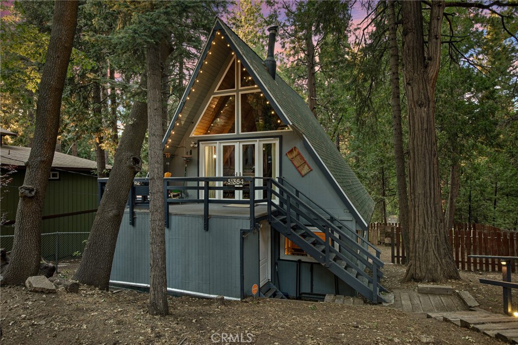 Welcome to your mountain escape! This beautifully remodeled mid-century A-frame cabin blends timeless architecture with modern upgrades. Featuring 3 spacious bedrooms and 1.5 updated baths, this turnkey home offers the perfect blend of comfort and style.
Centrally located in the heart of Running Springs, you're just minutes from local shops, dining, hiking trails, and ski resorts — making it an ideal year-round retreat or full-time residence.
From the striking A-frame silhouette to the warm wood accents and contemporary finishes, every detail has been thoughtfully designed. Whether you're relaxing by the fire, entertaining on the deck, or enjoying the peaceful forest surroundings, this home offers the quintessential mountain lifestyle.
Don't miss your chance to own this unique and inviting getaway!