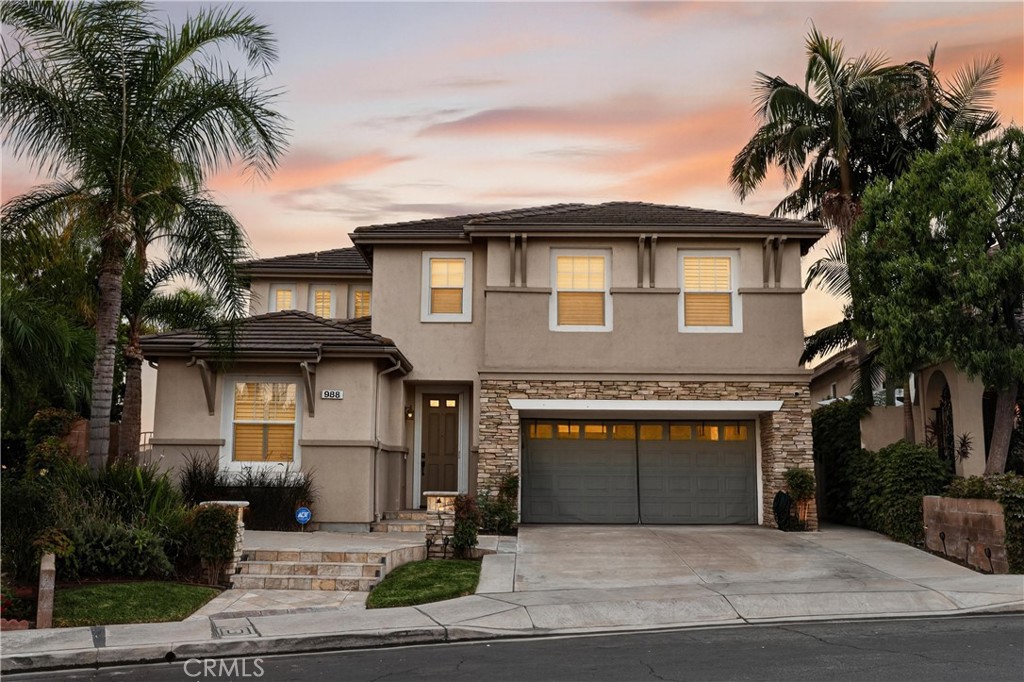 Discover Your Golf Course Oasis in Alta Vista South! Welcome home to spectacular views, luxurious finishes, and space to spare in this stunning Alta Vista South residence. Step inside to soaring vaulted ceilings that bathe the formal living and dining rooms in light. Just beyond, the gourmet kitchen awaits with granite countertops, stainless steel appliances, and a generous island, flowing seamlessly into an open-concept family room warmed by a cozy fireplace. Downstairs, the oversized travertine tile spans the floor—beautiful, durable, and low-maintenance. Enjoy your own primary suite with a fireplace, his & hers walk-in closets, and a spa-style bath with soaking tub, dual vanities, and a glass-enclosed rain shower, all overlooking the greens of the golf course. Three additional large bedrooms, a second full bath with dual sinks, and an expansive bonus room complete the upper floor. Outside, your private backyard paradise awaits, featuring built-in gas and charcoal BBQs, a covered patio, and a resort-style pool & hot tub with soothing waterfall sounds that elevate every moment of entertaining or relaxing. Parking and utility needs are covered with a 3-car tandem garage, equipped with ample storage and electric-car charging capabilities. Located in the heart of Placentia, you’re minutes from top schools, shopping, dining, and easy freeway access via the 91 and 57.