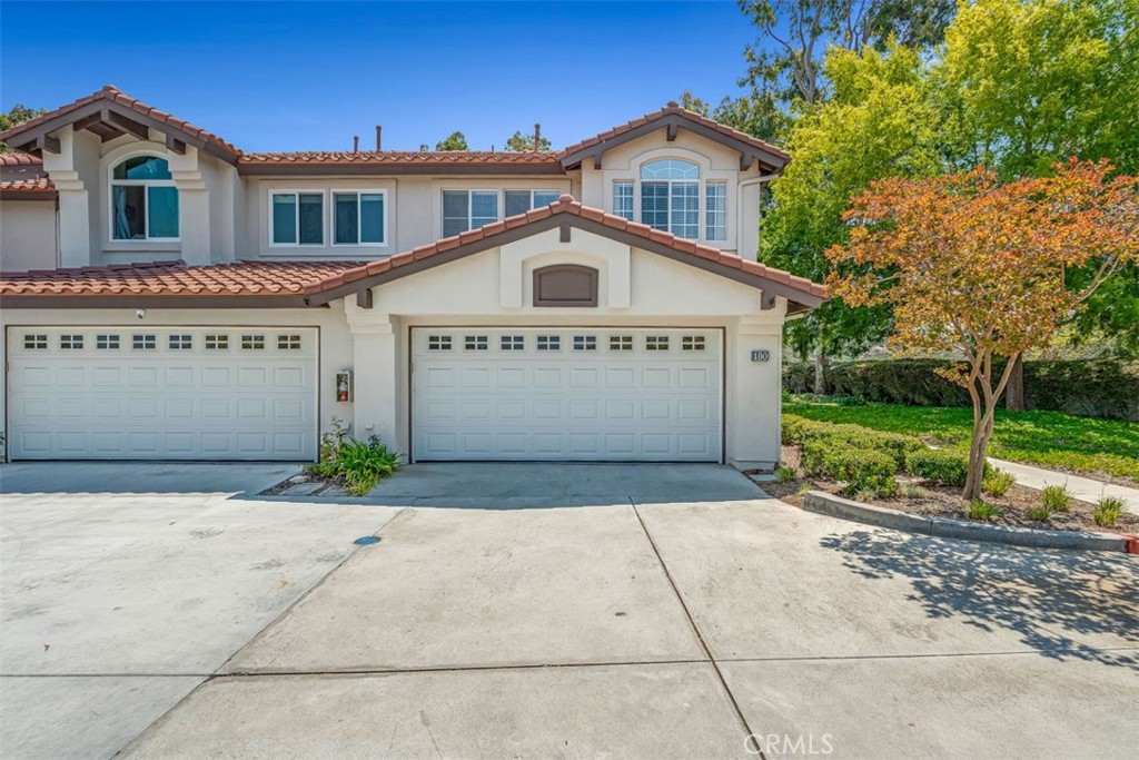 Discover tranquility in this rare and spacious 3-bedroom, 2.5-bathroom home, perfectly situated at the end of a quiet cul-de-sac. Boasting a gorgeous open floor plan and million-dollar panoramic views, this move-in-ready unit offers two distinct living areas downstairs, separated by a cozy fireplace. The interior shines with fresh designer paint and new luxury vinyl plank flooring on the stairs and upstairs, complementing the existing tile downstairs. Two large sliding doors on the first floor lead to a private yard with a patio cover, featuring fruit trees and ample space for vegetables, all while enjoying scenic views. Upstairs, natural light floods in through two skylights, illuminating the spacious bedrooms with large windows and generous closets. The extra-large primary bedroom is a true retreat, featuring a sliding door to a private balcony that provides breathtaking views of mountains, canyons, and hills, along with a large walk-in closet. This beautiful home is ideally located close to parks, award-winning schools, toll roads, shopping, and walking trails, within an unmatched neighborhood. Enjoy fantastic community amenities including a pool, clubhouse and more! Your peaceful hideaway awaits!