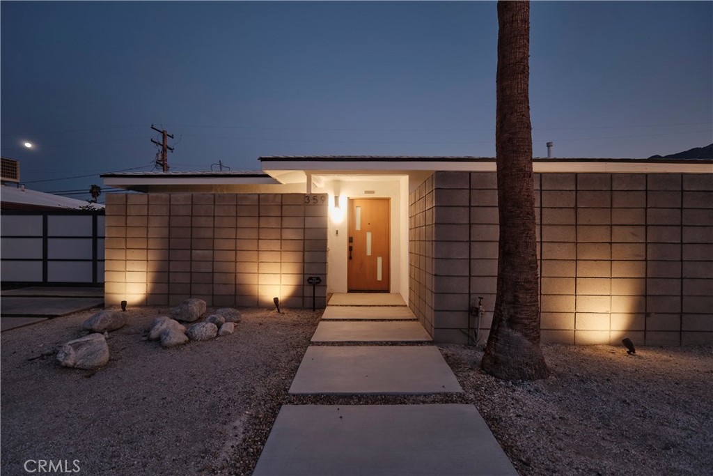 Experience quintessential Palm Springs living in this beautifully renovated midcentury modern gem, located in the fast-growing Desert Highland neighborhood. Thoughtfully upgraded and impeccably maintained, this stylish home blends timeless design with modern luxury—perfect as a private retreat or an income-producing property.
Enter through a striking motorized gate into your personal desert sanctuary, where a mature ficus hedge ensures total privacy and a sense of seclusion. Inside, the open-concept floor plan showcases a sleek gourmet kitchen with quartz countertops and stainless steel appliances, seamlessly connecting to spacious living and dining areas ideal for relaxing or entertaining. Designer steel and glass sliding doors frame views of the San Jacinto Mountains, filling the home with natural light and unforgettable scenery.
Step outside to experience true resort-style living. A sparkling saltwater pool and spa are complemented by an outdoor kitchen, pool house, and gym—creating the ultimate setting for leisure and luxury. Each bedroom suite features its own private patio, delivering a refined guest experience with comfort and privacy in mind.
Approved for Airbnb and comfortably within the city’s rental cap, this exceptional property presents a rare opportunity to own a turn-key vacation home with proven income potential in one of Palm Springs' most dynamic communities.