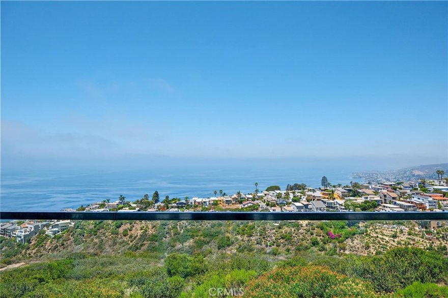 Fully furnished. Open to 6 months, month to month, short term- negotiable.Set in the hills of Arch Beach Heights, this one-of-a-kind multi-level Laguna Beach home offers sweeping panoramic views of the ocean, Catalina Island, coastline, and sparkling city lights from every level. Beautifully remodeled and move-in ready, this rare gem is perfectly positioned on an oversized 1.5-lot parcel, delivering the ideal blend of coastal luxury and laid-back charm. The main level welcomes you with an open-concept floor plan designed for seamless entertaining. A spacious living room and dining area flow effortlessly to a large ocean-facing balcony through expansive glass doors, creating a true indoor-outdoor experience. The designer kitchen is fitted with custom cabinetry, high-end quartz countertops, and premium appliances—crafted to satisfy both form and function. Upstairs, the primary suite offers a peaceful retreat complete with a private ocean-view balcony, a remodeled spa-style bathroom, a walk-in closet, and a second custom wardrobe for added space. Thoughtful upgrades throughout the home include engineered hardwood flooring, custom doors, recessed lighting, energy-efficient windows, and a new heating system with WiFi-enabled controls. Travertine marble lines the staircases and hallway, adding a touch of timeless elegance. The lower level features a private guest suite with its own entrance, bedroom, walk-in closet, and full bath—ideal for visiting family or potential rental income. The exterior is finished with smooth stucco, modern motion-sensor lighting, and tasteful landscaping that enhances both privacy and curb appeal. Just minutes from iconic beaches, scenic hiking trails, upscale dining, art galleries, and world-renowned resorts, this turnkey property captures the essence of Laguna Beach living—offered at a price that’s sure to generate serious interest.