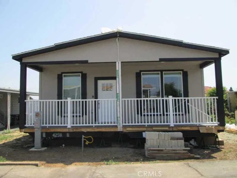 Welcome to The Fountains, a sought-after 55+ Community in La Verne. This Brand New Skyline Manufactured Home has 3 bedrooms and 2 bathrooms at 1512 sq. ft. (approx.). The entrance into the home is from the beautiful full front porch. Once inside you are greeted with a large living room that opens to the kitchen. The kitchen includes all the appliances: gas oven/range, dishwasher, built-in microwave oven, and refrigerator. The rooms are spacious and the primary room has an adjoining bathroom with a walk-in shower. Additional features: flooring in the living room, kitchen, hallway, carpet in the bedrooms, Laundry Room with full-size washer and dryer hookups, Central A/C and Heating, Covered Carport. The Fountains has a Beautiful clubhouse, pool and spa. This is a Great Opportunity to live in La Verne, don't hesitate.