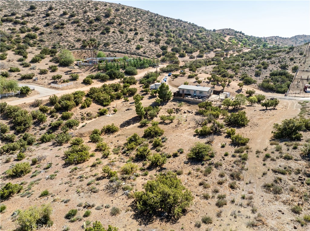 Nestled in the foothills of Acton below Parker Mountain, this quaint ranch property boasts amazing views, plenty of space for animals and hiking, and a good well that puts out plenty of water! The 2 bedroom 2 bathroom home features a large living area, kitchen with plenty of cabinets for storage and a brand new roof! Don't miss your opportunity to own this beautiful property overlooking Crown Valley!
