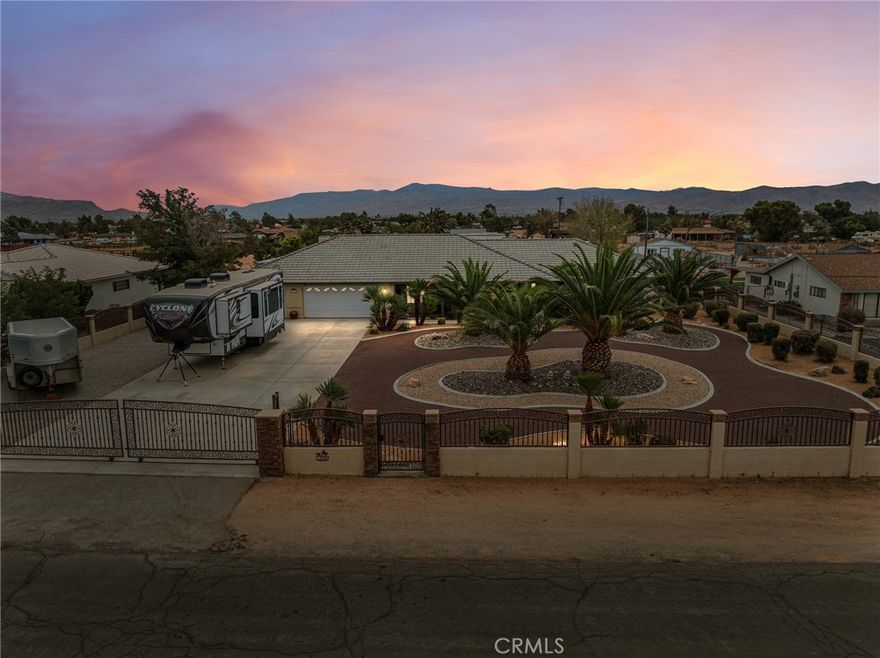 Absolutely Stunning Horse Property with Paid Solar & Luxury Upgrades! This incredible home boasts great curb appeal and a host of high-end features. Offering 4 spacious bedrooms, 3 full bathrooms, and 2,860 sq. ft. of living space, it’s the perfect blend of comfort and elegance. Step inside to the chef’s kitchen, designed to impress with new oak cabinets, granite countertops, a copper sink, top-of-the-line appliances, a massive walk-in pantry, and beautiful new tile floors throughout. The kitchen seamlessly opens to the living room, creating the ideal space for entertaining. The primary suite is a true retreat with soaring ceilings, a cozy fireplace, and private access to your backyard oasis. Upgrades can be found throughout, including new windows, ceiling fans, and more. The home is equipped with a 16.16 kW paid solar system (56 panels), dual Tesla Powerwall 28 kW battery backup systems, and a Tesla wall charger—bringing energy efficiency and peace of mind. Outside, enjoy a fully fenced yard with custom block wall and wrought iron fencing, artificial grass, and multiple outdoor living areas including a BBQ, firepit and lounge space. Additional highlights include a finished 3-car garage, two 40-foot storage containers with permits, RV/generator plug, RV parking, Horse stalls, above-ground spa, septic pump and cert on file, and more. This home truly has it all—luxury, function, and endless upgrades. A must-see property!