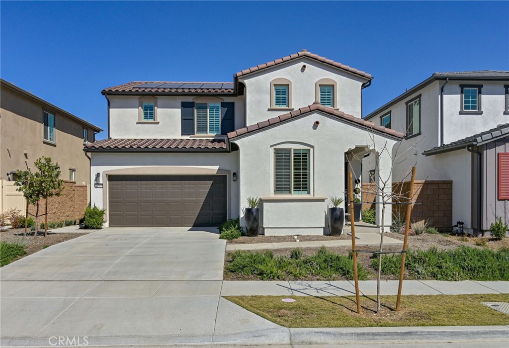 Highly upgraded 4 bedroom property in the gated community of Bedford, this spacious and modern home offers 4 bedrooms +loft and 3 bathrooms. Great floorplan: a main floor bedroom and full bathroom, ideal for multi-generation family; Huge family great room open to kitchen and dining space; On the second floor, generous primary suite with mountain view has dual vanities, large walk-in shower and walk-in closet, and the other two bedrooms, laundry room and big loft space with fantastic TV and sound system, creating theatre feeling at home. Lots of high quality upgrades: custom lights, elegant plantation shutter, handsome wood laminate floor, gorgeous kitchen making you chef experience, well designed and low maintenance backyard. Resort like community amenities: a Fitness Studio, Self-Serve Dog Spa, Event Lawn for Outdoor Movies, Fit Play Park, Firepit, Outdoor Lounge and 75-foot Saltwater Lap Pool with Shaded Deck…… Outside the community wall is the marketplace with Starbucks, Amazon Fresh, Shopping, Dining, banks, Gas & More. Easy Access to the 15 Freeway. Great schools in this area. Paid off solar panel will reduce your electricity bill a lot. This home will not last long, so come to see soon.