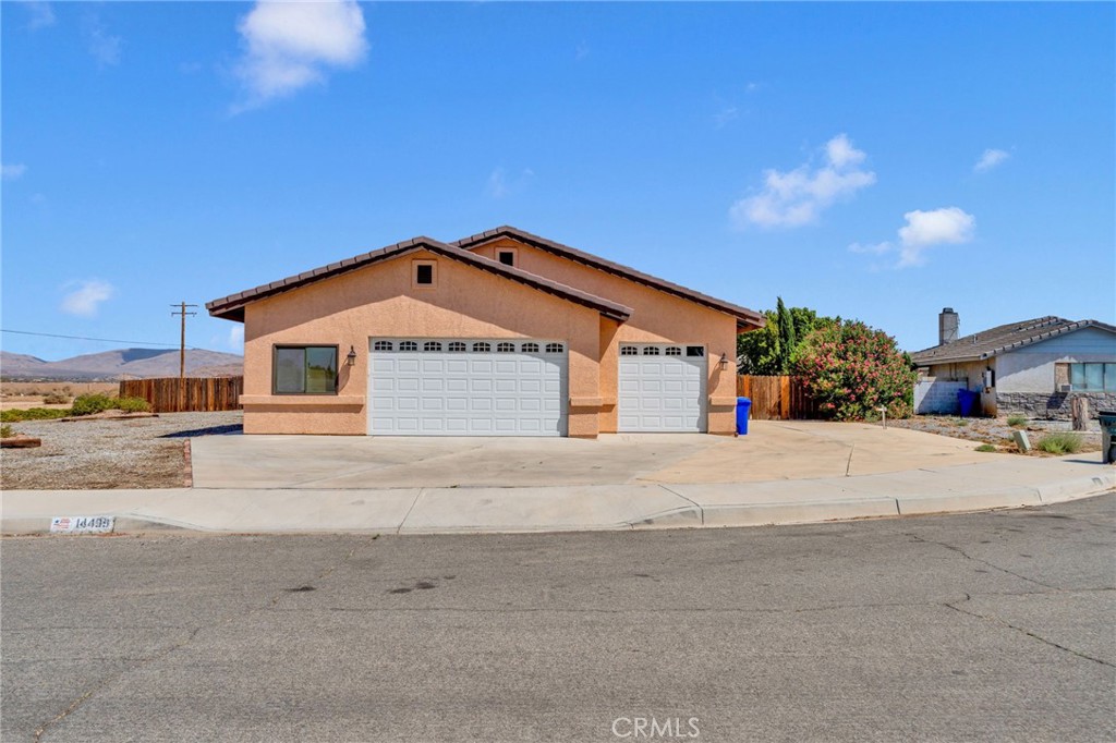 Discover this stunning home in the highly desirable Apple Valley neighborhood! Completely remodeled with beautiful backyard landscaping, a sparkling pool with a solar heater, and upgraded windows and Sliding glass doors. The paid-off solar panels significantly reduce Edison bills. Inside, you'll find 4 spacious bedrooms, a large game room, and a cozy wood-burning stove for chilly winter evenings. The oversized garage offers ample car or truck parking and plenty of storage. The side of the home also offers large space for boat or RV parking. A perfect blend of comfort, style, and plenty of space for all those summer BBQ swim parties!