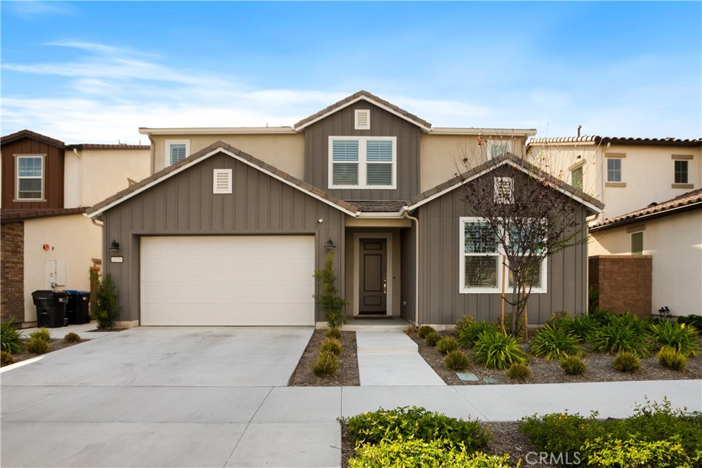 Looking for a home with an attached casita? Welcome to this beautifully upgraded residence in the sought-after Greenway community at The Preserve in Chino where luxury, convenience, and thoughtful design come together effortlessly.This move-in-ready home features paid-off solar panels, delivering significant energy savings and peace of mind from day one. The multi-generational en suite on the main floor is ideal for extended family, guests, or as a private retreat. With its own bedroom, full bathroom, kitchenette, and cozy living area, it offers unmatched comfort and privacy. Designed for both entertaining and everyday living, the open-concept layout boasts a gourmet kitchen with quartz countertops, a walk-in pantry, and an upgraded appliance package. A spacious center island easily accommodates four barstools perfect for casual dining and social gatherings. The adjoining living and dining spaces are highlighted by luxury vinyl flooring, adding both style and durability. Upstairs, the primary suite offers a tranquil escape with a large walk-in closet and spa-like bathroom featuring dual sinks, a soaking tub, and separate shower. You'll also find four additional bedrooms including one with its own bathroom. A versatile office/fitness room and a convenient upstairs laundry room complete the second level. Additional highlights include plantation shutters throughout, custom backyard hardscape and landscaping, and a 3-car tandem garage equipped with an EV charger. As a resident of The Preserve, you'll enjoy access to three exclusive clubhouses with fitness centers, pools, spas, sports courts, and more. Discovery Park, located next door, features a dog park, Tai Chi garden, basketball court, and obstacle course. Zoned for highly-rated Chino and Chino Hills schools and just minutes from shopping, dining, and entertainment at The Town Center at The Preserve, this home offers an unmatched lifestyle in one of Chino's most desirable communities.