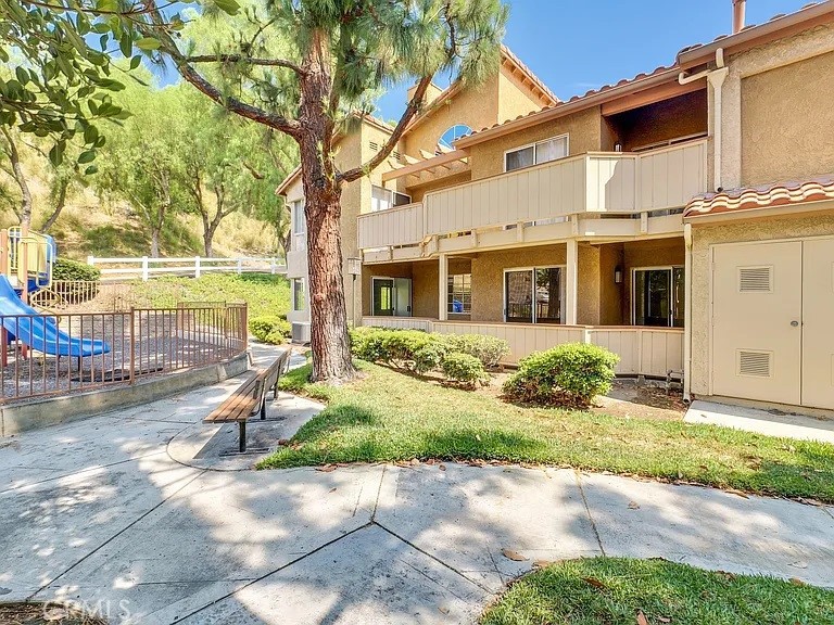 This immaculate turnkey condo is located in the prestigious "The Hills" surrounded by lush verdant landscaping! Beautiful Wood Laminate Flooring, Spacious Living Room with Vaulted Ceilings and a Cozy Fireplace. Loverly Dining Room with Chandlier. Upgraded Kitchen with Granite Countertops, Stainless-Steele Appliances and Recessed Lightings. Plenty of spaces of kitchen cabinets to store all of your storage needs. Master Suite with luxurious bath and a Walk-In Closet. Second Bedroom is also a good size with a Walk-In Closet. Sliding glass door provides access to the delightful patio to relax and enjoy. This End Unit offers Privacy and Quietness. Also, conveniently located near by a wonderful Playgrounds for Children. The Unit has two Reserved and Covered Carports, and Guest Parking Spaces. The Hills Community provides Two Pools, Three Spas, Tennis Court, Fitness Center and Clubhouse for Lifestyle you deserve. Easy Access to Freeways, Shopping, and Award-Winning Placentia / Yorba Linda School District.
Must see to Appreciate!