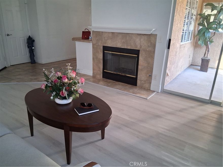 This immaculate turnkey condo is located in the prestigious "The Hills" surrounded by lush verdant landscaping!  Beautiful Wood Laminate Flooring, Spacious Living Room with Vaulted Ceilings and a Cozy Fireplace.  Loverly Dining Room with Chandlier.  Upgraded Kitchen with Granite Countertops, Stainless-Steele Appliances and Recessed Lightings.  Plenty of spaces of kitchen cabinets to store all of your storage needs.  Master Suite with luxurious bath and a Walk-In Closet.  Second Bedroom is also a good size with a Walk-In Closet.  Sliding glass door provides access to the delightful patio to relax and enjoy.  This End Unit offers Privacy and Quietness.  Also, conveniently located near by a wonderful Playgrounds for Children.  The Unit has two Reserved and Covered Carports, and Guest Parking Spaces.  The Hills Community provides Two Pools, Three Spas, Tennis Court, Fitness Center and Clubhouse for Lifestyle you deserve.  Easy Access to Freeways, Shopping, and Award-Winning Placentia / Yorba Linda School District. 

Come and see the beautiful home you've been waiting for!  * Recent Price Reduction * Must see to appreciate!