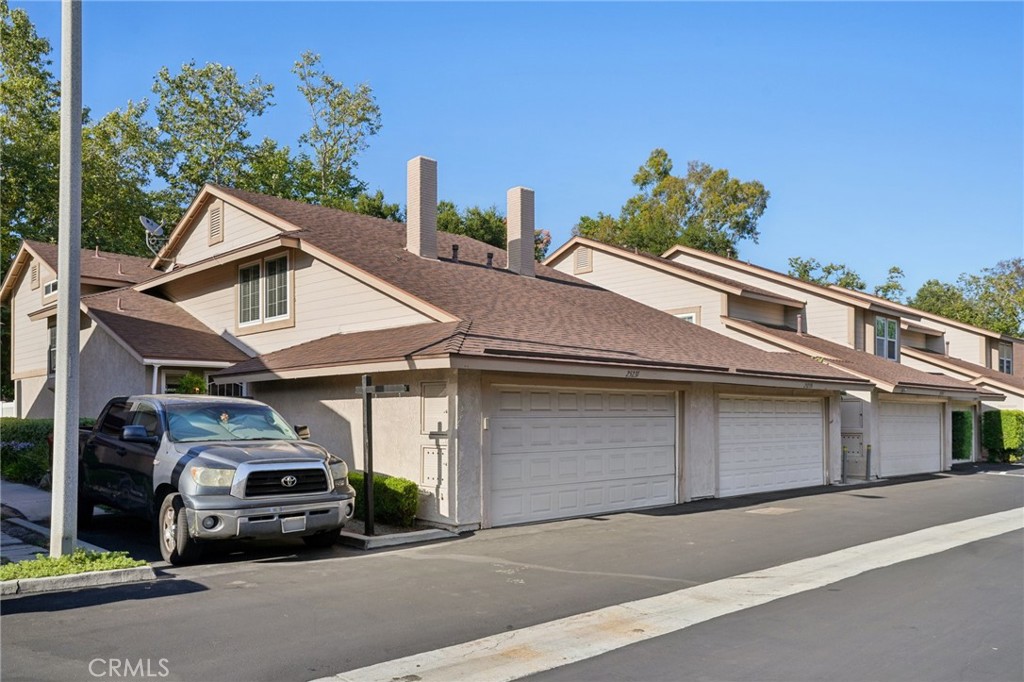 This beautifully upgraded end-unit townhome is tucked into a quiet, private corner of one of Lake Forest’s most desirable communities. The home has been thoughtfully renovated with every detail reflecting care and pride. A private gated front yard entry welcomes you into the home. Inside, you’re invited by brand-new luxury vinyl flooring throughout, creating a cohesive and modern aesthetic. The heart of the home is the gourmet kitchen, designed to impress with quartz countertops, stainless-steel Samsung appliances, a Bosch dishwasher, recessed and under-cabinet lighting, and custom solid wood soft-close cabinetry with built-in pull-out organizers and a powered center island. With three ovens and a spacious layout, this home turns Thanksgiving dinner—or any holiday gathering—into an effortless and unforgettable celebration. The open-concept layout flows seamlessly into both casual and formal dining areas, ideal for entertaining and a dream for hosting. The spacious family room features a gas-burning brick fireplace with a handcrafted mantle, plantation shutters, and upgraded ceiling fan that create a warm, inviting atmosphere that’s perfect for cozy evenings or lively get-togethers. A convenient half bathroom is located downstairs. Upstairs, the expansive primary suite includes a walk-in closet and an upgraded bathroom with a backlit mirror vanity and new glass shower doors. Two additional guest bedrooms offer comfort and style, one with a new ceiling fan, both with new shades, while a remodeled full bathroom sits just across the hall. Step outside to a private patio enclosed with new vinyl fencing and offering tranquil views of mature trees Additional highlights include a freshly painted interior, dual-pane windows, central air conditioning, a new water heater, upgraded PEX plumbing, new smoke detectors, updated outlets, and recaulked bathrooms. Additional offerings include an indoor laundry room, spacious two-car garage, and convenient attic access with pull-down stairs offer excellent functionality and storage. The community itself has 122 homes and has recently been reslabbed and repaved and features a resurfaced pool and spa, a fully renovated clubhouse, scenic walking paths, and lush greenbelt areas. All this, just minutes from local parks, trails, shopping, dining, and both the 5 and 405 freeways. This home is more than move-in ready; it’s a lovingly curated retreat that truly checks every box.