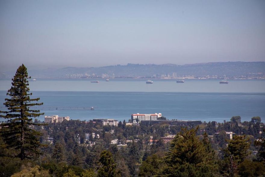 Completely transformed with a sophisticated modern aesthetic, this Hillsborough home showcases sweeping and spectacular Bay and San Francisco skyline views. High end down to the studs remodel in 2013 with no expense spared. Located in the coveted Lakeview neighborhood on just over one-half acre, features a striking two-story facade and generous outdoor spaces designed for entertaining around a sparkling pool, elevated spa, fire pit, and view decks. Inside, a dramatic double-height foyer highlights a sculptural staircase with glass panels and a wine display wall. Soaring ceilings and a two-story wall of windows frame the views in the open living and dining area with elevated gas fireplace and statement chandelier. The chefs kitchen offers lacquered cabinetry, quartz-wrapped island with glass counter seating, premium appliances, walk-in pantry, and adjoining casual dining area with banquette and family room that opens to the deck. Five bedrooms including one on the main level ideal for an office, plus a luxurious upstairs primary suite with fireplace, balcony, sitting area and spa-inspired bath. Smart home automation, air conditioning, and epoxy-finished large garage add modern convenience. Excellent Hillsborough schools with easy access to Highway 280 and downtown Burlingame.