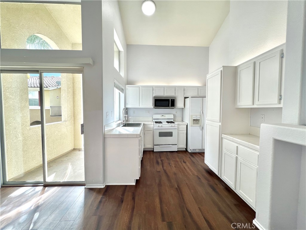 Welcome home to this beautiful 3-bedroom, 3-bath condo nestled in the Oak Creek community of Irvine. Spanning 1,350 sqft, this thoughtfully updated home offers a rare layout featuring two spacious primary suites—perfect for multi-generational living or flexible living space. Soaring ceilings and sun-drenched windows fill the open-concept living and dining area with natural light, seamlessly connected to the kitchen. Enjoy the ease of a 2-car attached garage with direct access, and take advantage of resort-style amenities just steps away, including a sparkling pool and fully equipped fitness center. Located in a secure gated community within the award-winning Irvine Unified School District, you’re just minutes from IVC, UCI, shopping, dining, golf courses, and major freeways. Don’t miss out on this opportunity to make this your home sweet home!