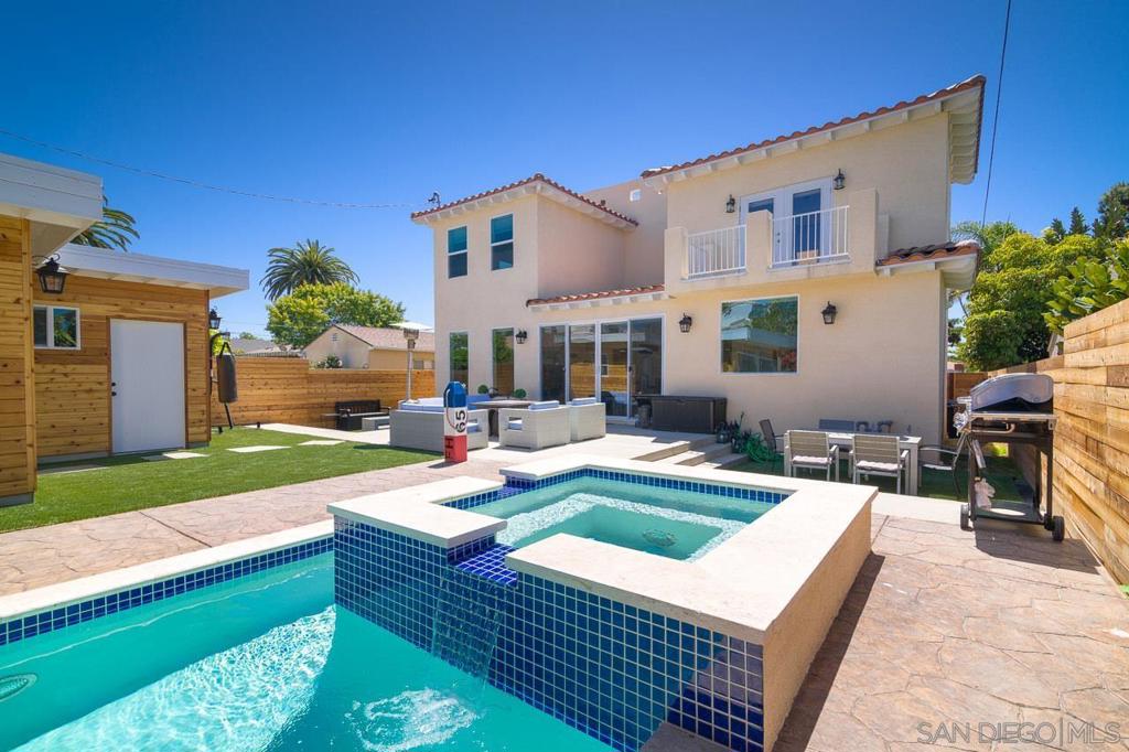 Just blocks from the sand, boardwalk, and vibrant heart of Pacific Beach, this 2017-built coastal retreat blends modern design with the relaxed elegance of Southern California living. An open-concept layout showcases a chef’s kitchen with Viking appliances, quartz countertops, and a built-in wine fridge, seamlessly connecting to spacious living areas and a private backyard oasis with a resort-style pool and spa. Entertain in style on the rooftop deck, where panoramic ocean and sunset views stretch from Mission Bay to the cliffs of La Jolla. Built for versatility, this home is equally perfect for raising a family, hosting unforgettable gatherings, or operating as a high-income producing short-term rental. Additional highlights include dual EV chargers, integrated sound throughout, and an unbeatable walkable location near top restaurants, boutiques, and outdoor activities. Experience Pacific Beach living at its finest in one of San Diego’s most coveted neighborhoods.