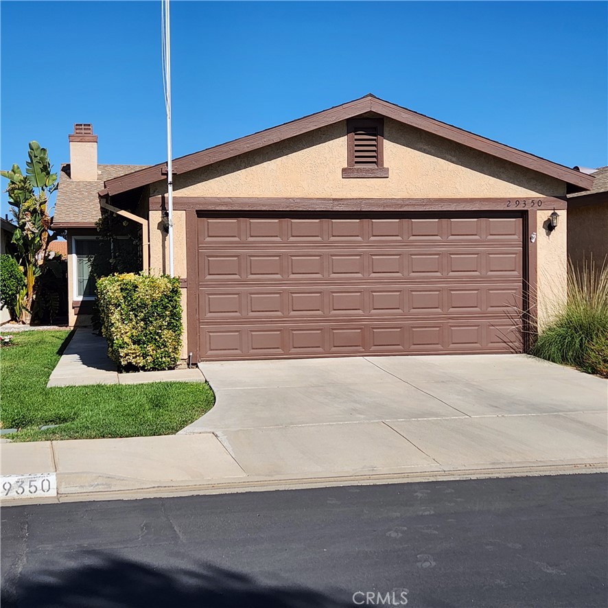 Welcome to your dream home in the sought-after 55+ community of Rancho Del Sol in Menifee! This meticulously maintained, single-story detached gem seamlessly blends modern comfort, energy efficiency and low-maintenance living at an exceptional value. Step into an open, airy floor plan where a spacious living room captivates with a soaring cathedral ceiling, cozy fireplace and elegant French doors. These doors lead to a private, fenced atrium, freshly painted with a revitalized wood beam, welcoming a gentle breeze. Gorgeous wood flooring and abundant natural light, amplified by newly installed double-pane windows throughout, create a warm, inviting ambiance. The kitchen is a delight, with tile countertops, a convenient breakfast bar, new vinyl flooring, new vinyl window blind, and ample cabinetry—ideal for everyday meals or entertaining guests. Two generously sized primary bedrooms, each with vaulted ceilings, ceiling fans, walk-in closets, and private ensuite bathrooms (guest bath with a newly upgraded sink), offer comfort and privacy, thoughtfully separated by the tranquil atrium. Energy efficiency with two newly installed rooftop wind turbines atop each bedroom, promoting whole-house airflow and expelling hot attic air to reduce air-conditioning costs during summer. A new smart Google thermostat adds effortless climate control.The serene backyard, featuring a new steel door opening east for excellent Feng Shui, bathes the home in soft morning light for an uplifting start to your day. With a spacious covered patio, tiled flooring, a new fence, and fresh paint, it’s a low-maintenance haven perfect for relaxing or hosting. With no rear neighbors and direct gate access to walking, jogging, and biking trails, enjoy peace in your private retreat. The attached 2-car garage, equipped with a new garage door opener and a fireproof door to the guest bedroom, plus a long driveway, provides ample parking and storage. Additional upgrades include fresh interior and exterior paint, a newer hot water heater, and new vinyl flooring in the kitchen, dining area, and bathrooms.The HOA handles exterior maintenance—stucco, paint, roof, fencing, gates, and front yard landscaping for a worry-free lifestyle. Community amenities include a pool, spa, and clubhouse. Conveniently located near Menifee’s shopping, dining, and recreation, this home offers the perfect balance of affordability and vibrant 55+ living. Don’t miss your chance to own this move-in-ready gem.