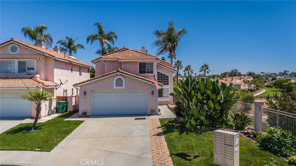 This wonderful home could be the ONE! Located in central Oceanside between the 76 and 78, this 4-bed, 3-bath, 2,350 sq ft home sits at the end of a peaceful cul-de-sac with no neighbors behind or to the south—offering rare privacy. Lifestyle matters here: picture peaceful mornings with coffee, glowing fireplaces in winter, ocean breezes in summer, and stargazing with a glass of wine in hand. Trails and parks are just minutes away, and when you’re ready to head out, the best of Oceanside’s beaches, dining, and nightlife are close by.
Inside, you'll love the vaulted ceilings, large windows, and grand curved staircase. The entry patio is perfect for unwinding at sunset or hosting intimate get-togethers. Downstairs includes a bedroom and full bath—ideal for guests or multigenerational living. The dining area features a double-sided gas fireplace that connects to the cozy family room, setting the tone for memorable dinner parties and relaxed evenings.
The kitchen is bright and well-appointed, with grey shaker cabinetry, quartz countertops, matching appliances, and plenty of prep space. A cheerful breakfast nook sits just beyond the kitchen, next to the family room fireplace.
Step out back to a charming low-maintenance yard that invites weekend relaxation, not yard work. Upstairs, light streams through skylights as you head toward three large bedrooms, including a huge primary suite with space for a sitting area or workspace. The two secondary bedrooms share a convenient Jack-and-Jill bath—great for kids or guests.
This home is also close to excellent schools—MLK Jr. Middle and El Camino High are just over a mile away. Sports fans and concert lovers will appreciate the nearby Frontwave Arena, and the So Cal Sports Complex is about a mile away for soccer families.
All this in one beautiful package. Don’t miss your chance to make it yours!