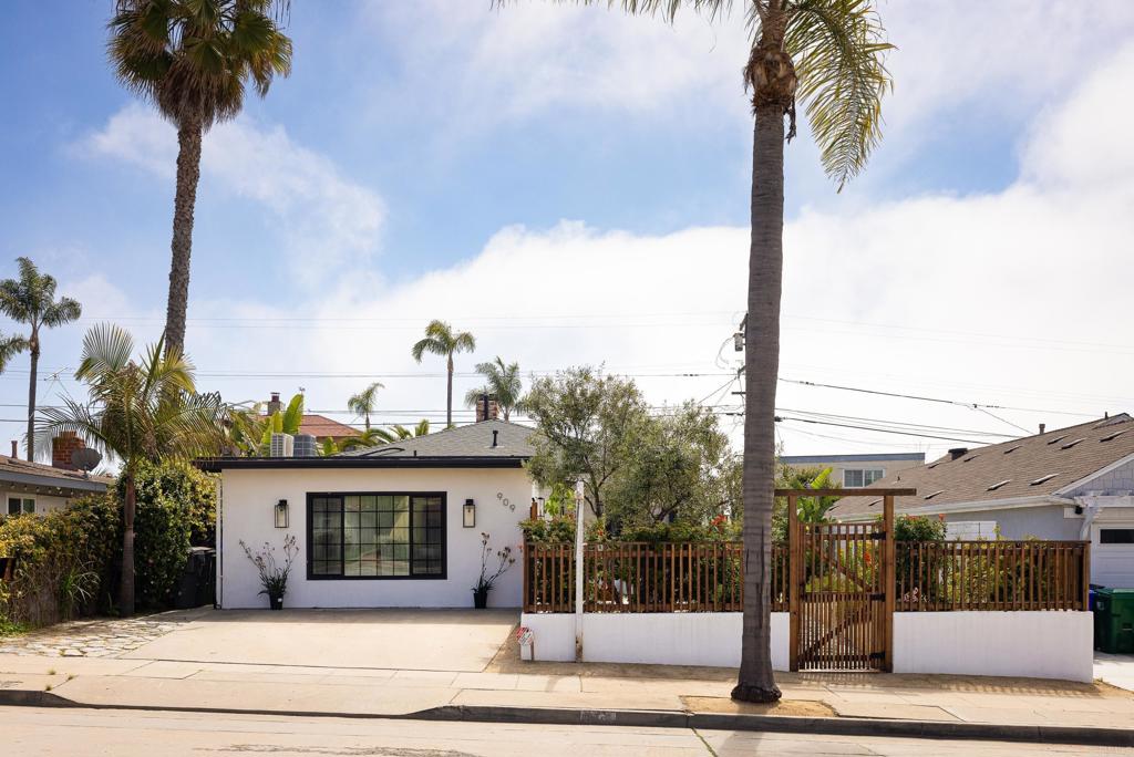 RARE gem in Oceanside’s historic Seaside neighborhood, famed for its white concrete streets & vintage charm. Perched on a PRIME OCEAN-VIEW street west of the 5, this classic California beach bungalow offers perfect walkability, an indescribably serene atmosphere designed for wellness and relaxation. Westerly OCEAN breezes keep fresh air circulating through this natural haven, updated with modern Non-toxic upgrades. Window-lined walls bathe every space in natural light. Preserved charm includes restored original hardwood floors, vintage molding, architectural details, and a gorgeous wood-burning fireplace for cozy evenings. The modern kitchen features ample storage, an adjacent dining area which opens up to a deck making this an ideal space for culinary and entertaining enthusiasts. Bathrooms are tastefully updated. Separate in house laundry area includes additional storage. Main house feature an updated ac/ central heat and ducts The clean, ZEN-Mediterranean landscape features fruiting olive & orange trees, an organic medicinal herb and vegetable garden. The designer-fenced front yard offers a serene space to enjoy sunsets. The separate backyard and grounding deck add a natural oasis. A stunning, permitted ADU ( generates an average of $2600 per month when rented) with private entrance, kitchen, bath, dining area and in unit laundry adds many options including rental income, multi-gen living, office, or a guest house. As an additional upgrade, ADU features a mini split system for indoor temperature control. Possibilities for a roof deck for breathtaking ocean and sunset views. Walk to the beach, award-winning restaurants, downtown Oceanside, and the iconic pier. With quick access to train, freeways and airports, this home offers an ultimate coastal lifestyle.