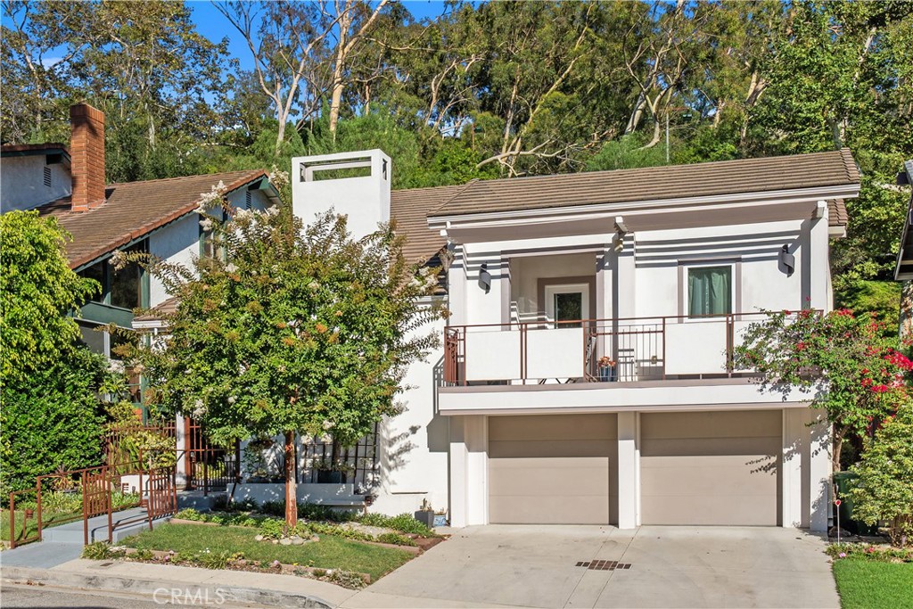 Welcome to this beautifully expanded 5-bedroom, 4-bathroom home nestled in the heart of the coveted Bel Air Glen community, a highly sought-after, and well-established enclave known for its serene ambiance and convenient location. Tucked away on a peaceful and quiet cul-de-sac just moments from Mulholland Drive and Sunset Blvd, this rare offering perfectly balances peaceful seclusion with close proximity and easy access to West LA, Beverly Hills, Bel Air, Rodeo Drive, the 405 freeway, and both the Westside and San Fernando Valley--an ideal setting for professionals and families alike.
Inside a bright, airy and open floor plan features soaring ceilings, warm wood floors, and an abundance of natural light. A formal living room with a cozy and inviting fireplace blends warm yet contemporary style. The thoughtfully designed family room seamlessly connects to a functional and family-friendly kitchen, adjacent to a formal dining room that is perfect for everyday living and entertaining alike. Upstairs, the oversized primary suite is an intimate and private sanctuary featuring ample closet space and a spacious, and spa-style en-suite bathroom. Four additional bedrooms provide generous and comfortable accommodations, with dedicated spaces for family, guests, home-office needs, or flexible bonus rooms for a gym, playroom or studio. Step outside to an intimate and secluded deck where a built-in spa invites you to unwind in a tranquil, Zen-like setting ideal for al fresco dining, morning coffee, or relaxing with a good book and a glass of wine. As a resident of Bel Air Glen, you'll enjoy access to a full suite of HOA amenities including a newly renovated fitness center, pool, spa, locker-room, two tennis courts lighted for night play, pickleball courts, lighted basketball court, clubhouse, children’s playground, park, nature trails and all within a 24-hour security-patrolled neighborhood.
The home is just a short stroll to the Glen Centre, a beloved and trendy local hub featuring chic restaurants, boutiques & upscale conveniences. Located in the top-rated Roscomare Road Elementary School District, and near several premier private schools, this residence offers an idyllic location with seamless access to virtually all the best that LA has to offer. This unique Bel Air Glen gem presents exceptional value with ample space, making the ideal backdrop for creating your family's best moments yet! Your future home awaits- so schedule a private tour today!