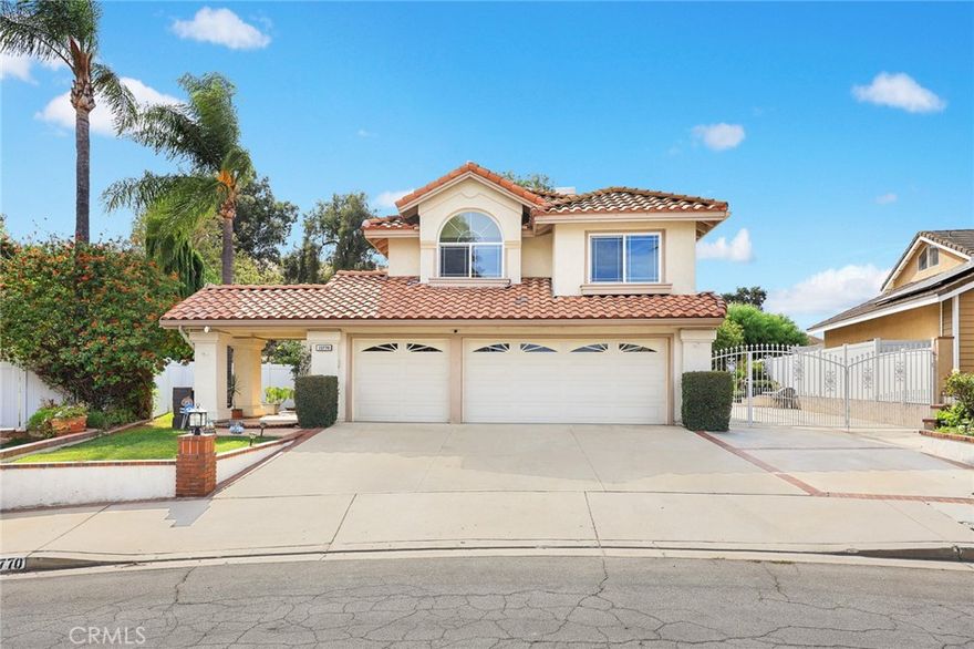 Nestled on a quiet street in the highly sought-after neighborhood of Village Oaks,  this beautifully updated 4-bedroom, 2.5-bath home sits on a generous 8,200 SqFt lot and offers 2,268 SqFt of thoughtfully designed living space. 

Step into a bright and airy main level featuring elegant hardwood floors, high ceilings, and abundant natural light. The formal living room is highlighted by large windows framing serene tree views, while the adjoining dining room opens through French sliding doors to the sparkling backyard pool. The newly updated kitchen boasts quartz countertops,  with matching backsplash, modern cabinetry, stainless appliances  and a cozy breakfast nook. The inviting family room with a warm fireplace provides the perfect space for everyday living and entertaining. A convenient laundry room with extra storage and a powder room complete the main level. 

Upstairs, the spacious primary suite features an updated ensuite bath, a walk-in closet, and access to a spacious private balcony with beautiful mountain views, and lush green surroundings. Three additional bedrooms and a full bathroom offer plenty of space for the family.



Designed for true California living, the resort-style backyard includes a heated pool and spa safely enclosed by metal fencing, a covered patio, built-in BBQ island, and a well-maintained lawn. Mature fruit trees, such as avocado, pomegranate, loquat, and banana, which add natural beauty and shade, while a gentle slope with lush greenery ensures exceptional privacy.

Additional features include recently refinished kitchen cabinets and countertops, new flooring, fresh interior paint, recessed light, dual-pane windows and doors, water softener and filtration system, solar panels, a security system, and a large RV parking area with gated concrete side yard, which might a perfect site for pickleball. A three car attached garage provides ample storage and convenience.

Excellent location near Oakridge Elementary and community parks, with easy access to shopping, dining, and major freeways. A rare opportunity to own a home that truly has it all, style, space, location, and a resort like outdoor lifestyle. Welcome home to Village Oaks in Chino Hills, claim this home yours.