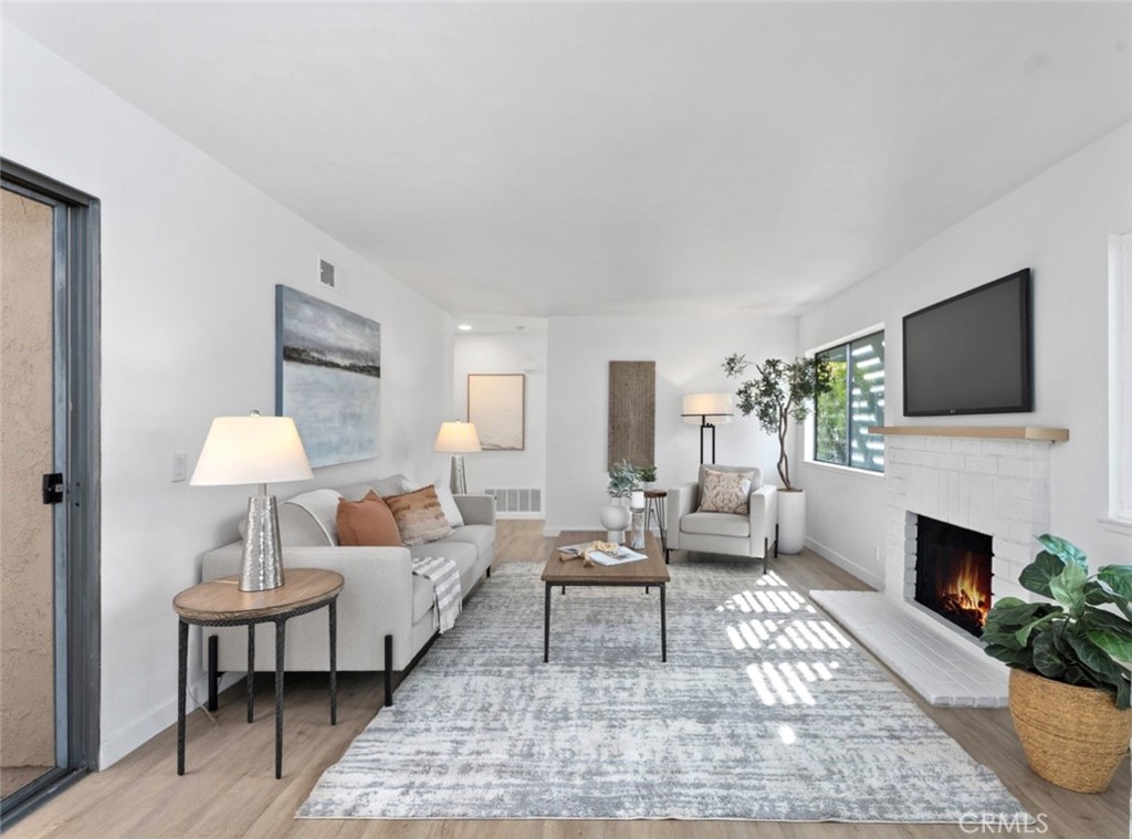 Welcome to this exquisitely renovated single-level, home designed for elevated living in the highly sought-after Gingerwood community! Every detail of this home has been thoughtfully reimagined to blend modern sophistication with everyday comfort. New luxury vinyl plank flooring flows seamlessly throughout the home, with fresh interior paint, and new lighting and hardware throughout, complementing the chic, contemporary but comfortable design. The home features a two-car garage with a laundry area, new roof (2023), newer AC (2021), a spacious primary suite with private bath, renovated bathrooms, and a cozy living room with a fireplace for added ambiance. The updated kitchen features new quartz countertops, refreshed cabinets, new hardware and a brand new dishwasher and refrigerator. As a corner unit, you’ll enjoy the privacy of the outside patio and side yard with no neighbor on one side—perfect for relaxing or entertaining. Enjoy the benefits of an amazing community with quality schools, low HOA dues and amenities, including two parks, a pool and spa, a clubhouse with tot-lot, and basketball and tennis courts. Enjoy a quiet, friendly neighborhood with convenient access to schools, shopping, dining, freeways, Cal State Fullerton, Brea Mall and nearby restaurants. Located in the top-rated Brea-Olinda Unified School District, this move-in ready home is perfect for families, professionals, retirees, or investors seeking a strong rental opportunity.