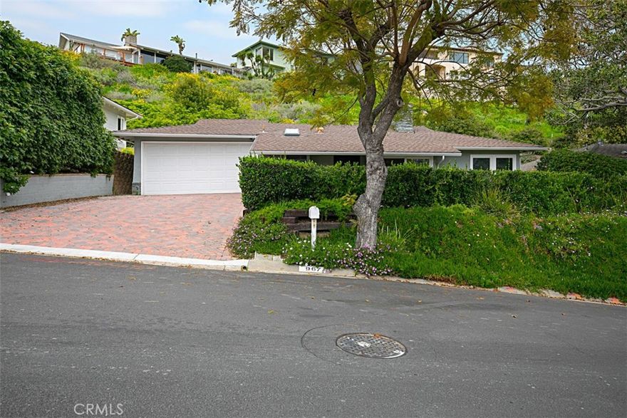Updated 2 bedroom (plus den!), 3 bathroom family residence in Laguna Beach, located in beautiful Blue Bird canyon surrounded by dramatic natural vistas unique to Laguna Beach. Charming curb appeal, contemporary finishes in all bathrooms, recessed lighting and central A/C make this home a rare find in Laguna Beach. Newer wood laminate flooring, paint and updated kitchen with stainless steel appliances for easy everyday living. Private front yard with a picnic table featuring built-in grill is great for entertaining! Laguna Beach trolley takes you to Laguna's scenic beaches and downtown restaurants/shops. Convenient to Bluebird Park with tons of play area for the little ones. Short drives to nearby Laurel Canyon Wilderness Park/Trails and Crystal Cove State Park. Note: Refrigerator, washer and dryer are not included and photos show previous staging furniture.