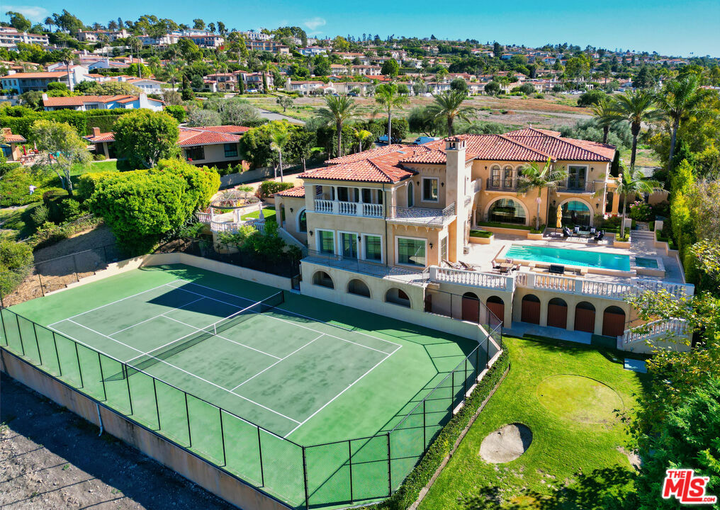 This magnificent villa was built in 2011, then updated in 2019 and 2020. This home includes exquisite details of high-end European interior design, the ultimate in luxury and refinement. It has five en-suite bedrooms, a separate helper's quarter with its own entry, a formal living room, a huge family room, a game room, a study, an elegant dining room, a gourmet kitchen with a breakfast nook, a full eating counter, and food preparation areas. All bedrooms are equipped with Jacuzzi tubs and Toto water closets. The primary bedroom features his and her closets with built-in cabinets, a spacious bath equipped with separate toilets, double sinks, a large steam shower, and a beautifully designed makeup table with a mirror and sconces. Home is also equipped with elegant light fixtures, custom multi-layered window coverings, carved stone fireplaces, a wine cellar, two wet bars, an elevator, central air, a Crestron system, Venetian paint in all public areas, marble/Onex/stone/wood floors, etc. This home has about 8700 sq. ft. on a lot of approximately. 30,000 sq. ft.; fully landscaped with pool, spa, fire pit, gazabo, putting green, tennis court, circular driveway and a four car garage, fully fenced and gated. It will be sold furnished, with just a few items excluded, those with sentimental value to the seller. Art and decoration items are not included. Too many features to list; seeing is believing. One of the very few homes available on the market with such elegant taste.