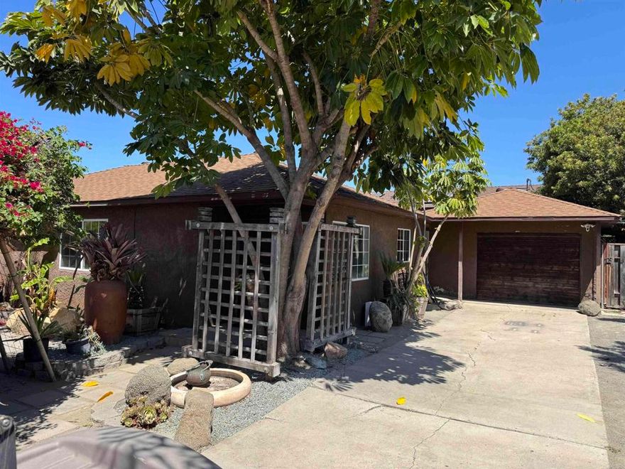 Charming 3-bedroom, 1-bath home in the heart of National City with two additional income-producing units! This versatile property features a main house with hardwood floors throughout and an updated kitchen with tile countertops and newer cabinetry.  In addition to the approximate 1,050 sq.f.t. main home, the property includes a detached 1-bedroom ADU (approx. 450 sq.ft.) and a studio Junior ADU (approx. 400 sq.ft.), each with private entrances, long rental history, and monthly income of $2,000 and $1,800.  All three units offer private front and back yards, creating a rare blend of space, privacy, and flexibility — perfect for extended family, rental income, or live-in-one-rent-the-others opportunities.  Located near schools, shopping, freeways, and just minutes from Downtown San Diego and the Naval Base, this property offers incredible potential for owner-occupants or investors alike.