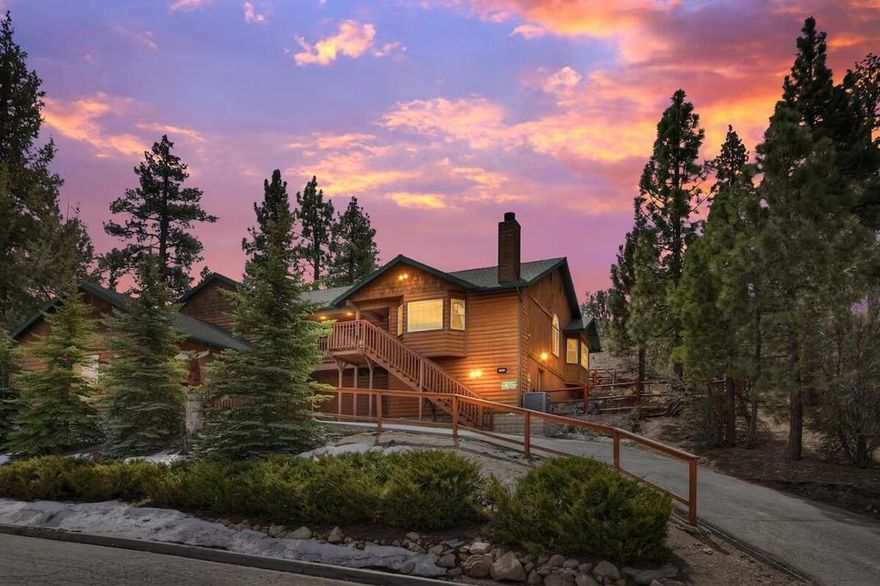 This Eagle Ridge Drive retreat sits in prestigious Castle Glen, one of Big Bear Lake's premier neighborhoods, surrounded by upscale homes and close to the Village, lake, ski resorts, and shopping. The single-level log-style design rests on a spacious half-acre lot and offers comfort, privacy, and classic mountain character. The open great room welcomes you with a wood-burning river rock fireplace, high T&G knotty pine ceilings, wainscoting, and an easy-flow layout ideal for relaxing or entertaining. The kitchen features custom cabinets and a breakfast bar with adjacent dining area. The primary bedroom suite includes a well-appointed bath with spa tub and dual sinks. Set above the street and backed by an upslope, the home enjoys a peaceful, elevated position with treetop and valley views. An outdoor hot tub provides a quiet place to unwind under clear Big Bear nights. Central heating and rare air conditioning offer year-round comfort. The attached garage--currently used as a game room--adds versatile space for recreation or storage. With an extraordinary vacation-rental income history in a prime location, this property is an appealing choice for both personal enjoyment and savvy investment.  Grossed over $113,000 in 2024!