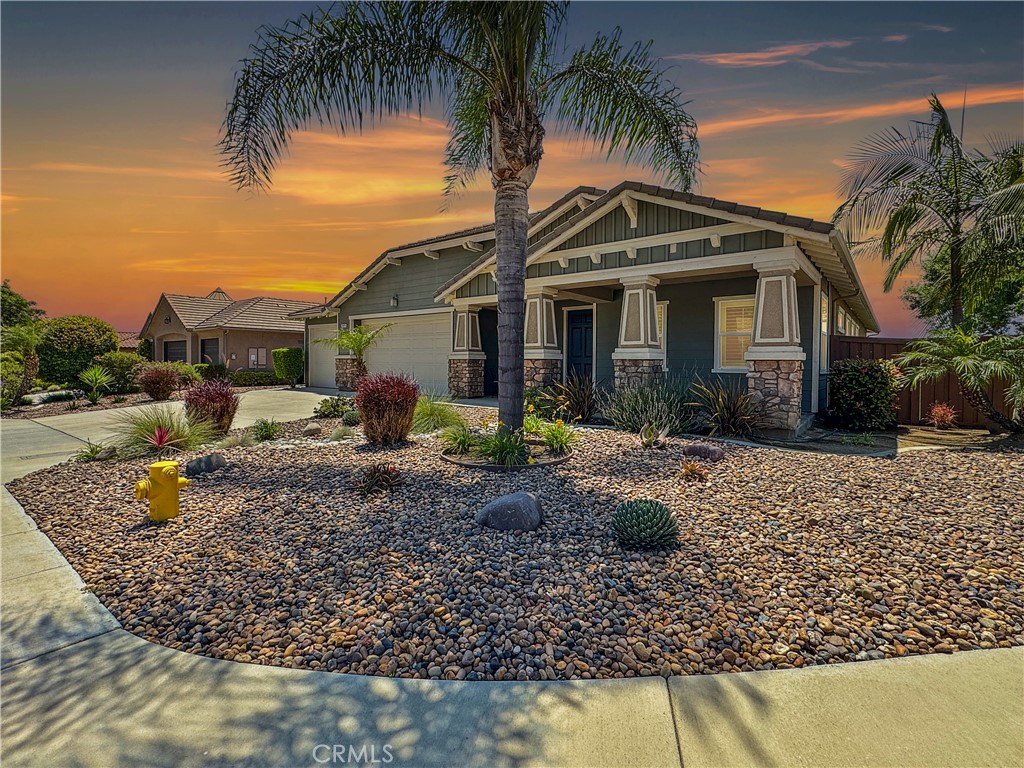 Welcome to 2025 James Gaynor, a sprawling single-story estate nestled on a prime corner lot in the prestigious gated community of Shady Grove. This meticulously maintained home offers over 3,200 sq ft of luxurious living space, featuring 4 spacious bedrooms, 3.5 bathrooms, formal living and dining rooms, a butler’s pantry, and a stunning gourmet kitchen with custom European cabinetry, granite countertops, stainless steel appliances including a double oven, and an oversized island with stainless steel sink and wall-to-wall cabinets for abundant storage. The open-concept layout flows seamlessly into a large family room with a gas fireplace, custom precast surround, wood shutters, and elegant ceramic tile flooring throughout. The expansive primary suite feels like a private retreat, with space for a sitting area or office, and a spa-like bathroom featuring polished marble floors, a limestone-clad walk-in shower with bench seating, a separate soaking tub, and dual sinks with a built-in vanity. All secondary bedrooms offer ceiling fans, plush carpet, and custom window coverings. The home also boasts a large laundry room with storage cabinets and a sink, as well as a fully finished 3-car garage with insulated doors and overhead storage racks. Step outside into your private backyard oasis—perfect for entertaining—with a sparkling pebble tech pool, drought-tolerant landscaping, and a concrete walkway leading from the driveway to the rear yard. This home also includes a fully owned, PAID OFF SOLAR ENERGY SYSTEM—offering significant monthly utility savings and eco-friendly living with no lease or financing to assume. Also enjoy recessed lighting, upgraded fixtures, and ample linen and hallway storage. Shady Grove offers tree-lined streets, three private parks, pickleball and basketball courts, dedicated RV parking, and a friendly, walkable atmosphere. This exceptional residence is the perfect blend of comfort, elegance, and resort-style living—don’t miss the opportunity to make it yours.