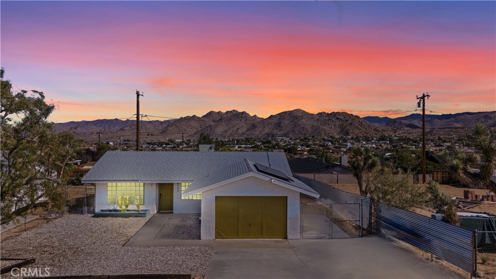 This 3 Bedroom, 1 Bath turn-key haven is ready for you—FULLY FURNISHED and styled to perfection. With Solar this home is both eco-friendly and cost-efficient. Just steps from downtown Joshua Tree and only minutes from the National Park entrance, this bright and inviting retreat offers both convenience and desert charm.
Enjoy peaceful surroundings, gorgeous mountain views, and a true move-in ready experience—no remodeling, no furnishing, no stress. Just bring your toothbrush and step right into the Joshua Tree lifestyle.
The outdoor spaces are just as special—multiple seating and dining areas, a custom mural patio, firepit for late-night conversations, and a relaxing hot tub perfect for stargazing under the desert sky.
With solar in place, style, and location—this isn’t just a home, it’s a destination. Don’t wait—schedule your showing today!