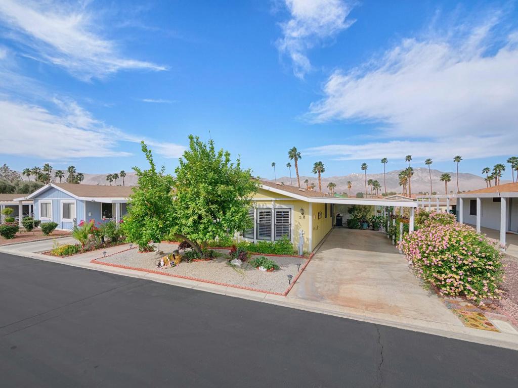Welcome to SunCrest Country Club an active 55+ gated community with lots of Amenities for you to enjoy! This very well maintained partially furnished home has 2 beds/ 2 baths and an open floor plan with high vaulted ceilings that make it feel much larger than it is. Kitchen and Baths have been updated with granite counter tops and kitchen has a water filtration system as well.(Never buy bottled water again) Laminate flooring throughout & ceiling fans in both bedrooms. There is also a large storage unit or can be used as a Golf Cart garage!!Your outside space is a gardener's Paradise surrounded by many of the desert's flowers,cacti and Hummingbirds! Suncrest is a rent controlled community and is a private land lease. There is a 9 hole golf course to enjoy in your spare time along with Pickle Ball, Tennis, game room, Library and Jazzy J's food and Drink! This location is centrally located close to great restaurants and shopping. The PS airport is only 20 minutes away. Don't miss this GEM!!