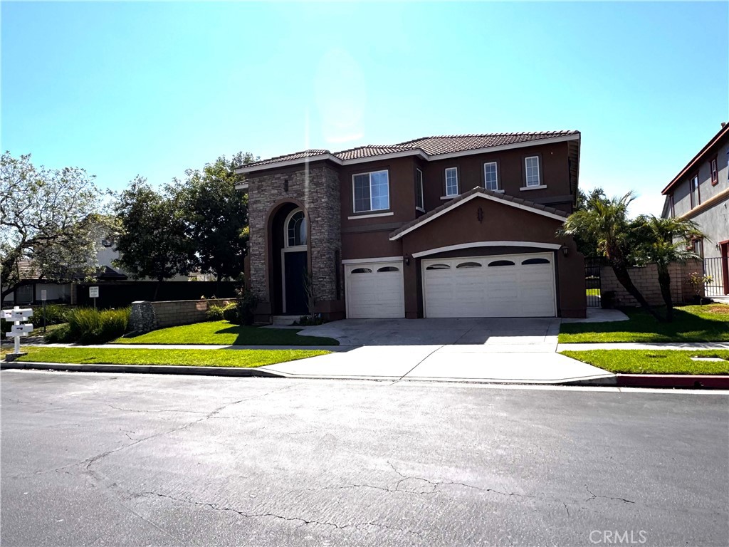 Spacious 5 bedrooms Home in Hawthorne Gated Community, home next to park and green belt area, 20 ft high cathedral ceiling in living room, formal
dining Room, large kitchen with granite food island, walk-in pantry, tile flooring, breakfast nook. Spacious family room with fireplace and ceiling
fan. New interior paints, 2 bedroom & 1.5 bath downstairs. Upstairs extra large bonus room, 10 ft. computer desk over seeing living room
& green belt view. Large master bedroom with two spacious walk-in closet and a gas fireplace, master bath with shower enclosure, oval tub and granite flooring. Upstairs laundry room. Downstairs . New wood flooring installed upstairs. Downstairs 2 Bedrooms , 1.5 Bath, New shower enclosures and glass sliding door. Large covered patio area. Attached 3 car garage. next to Community Park & Green Belt. Easy access to supermarkets, Target and #10 Freeway.