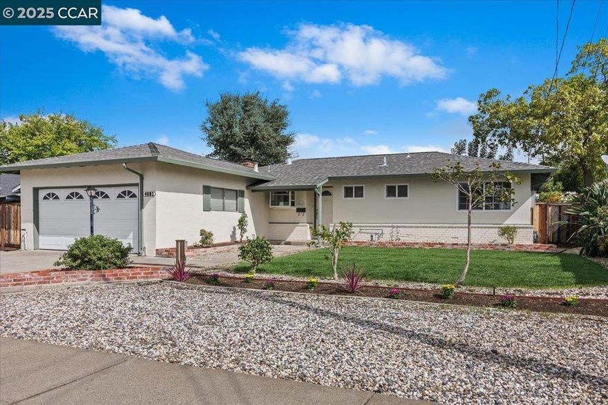 A gem in the heart of Concord!  Featuring 3 bedrooms and 2 bathrooms, this single-level home has been beautifully reimagined and is move-in ready.  Newly painted interior, gleaming hardwood floors, and dual pane windows throughout. The updated kitchen sparkles with it's garden window, all-new quartz countertops, new appliances including refrigerator, range, dishwasher, vent hood and stainless steel sink.  Dining area and living room with fireplace and mantle. Primary bedroom en suite with new bathroom vanity.  Freshly landscaped yards with new front and rear lawns.  The spacious backyard has mature fruit trees, and plenty of room to play, entertain and dine outdoors.  A 2-car garage and wide driveway provide plenty of space to park your vehicles.  Located in one of Concord's most desirable neighborhoods - close to nearby restaurants, stores, K-12 schools, and just minutes to the Concord BART station. 4081 Salem Street...Welcome Home