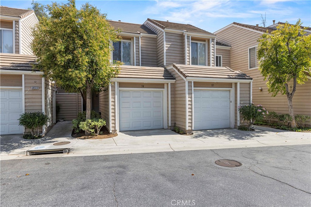 Welcome to your new home in the heart of Valencia! This beautiful Franciscan Hill townhome offers 2 spacious bedrooms, 2.5 baths, and over 1,200 sq ft of inviting living space. As you enter, you’ll appreciate the easy layout with direct garage access, a stylishly updated kitchen featuring stainless steel appliances, white cabinets, quartz countertops, tile floors, a cozy breakfast bar, and a convenient pass-through to the dining area. The step-down living room features warm wood laminate floors, a charming corner fireplace, and a private balcony with stunning views, as well as additional storage space.
Upstairs, you'll find two generously sized en-suite bedrooms, each with walk-in closets, wood flooring, and one with a fireplace. The natural light pours in through the skylight, and the upstairs laundry closet includes a stacked washer and dryer for your convenience.
Enjoy guest parking and a community pool and spa steps away. You’re also just minutes from CalArts, COC, Valencia Town Center, great restaurants, and the 5 freeway. This is the perfect blend of comfort, location, and lifestyle!