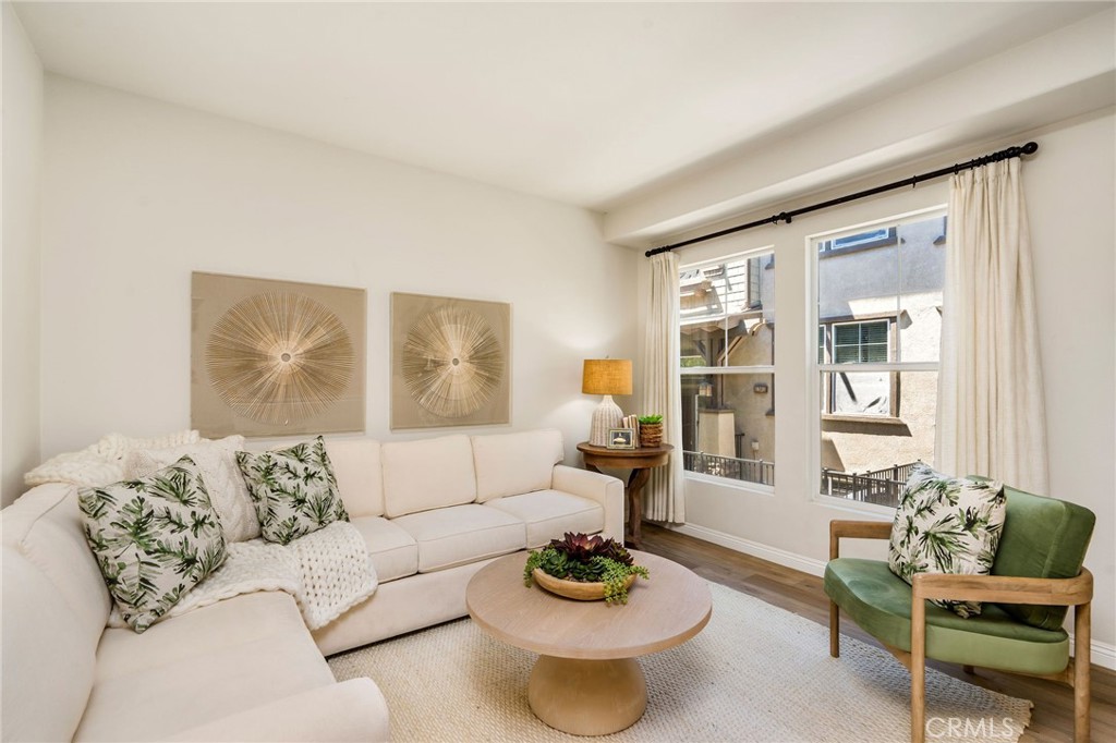 Welcome to this beautiful updated townhome, located in the private gated community of Stonehaven. Built in 2005, this original owner recently updated the home with new vinyl plank flooring, new quartz counter and a stainless, French-door refrigerator in the kitchen. Front entrance has private patio and main entry level is open and airy, with tons of natural light. A large living room and dining room that flows right into the kitchen with a nice-sized peninsula and bar counter. makes it's easy to entertain. There's also a large pantry and powder room. Follow the wide staircase with modern banisters upstairs to the hallway with lots of storage cabinets. The primary ensuite a big enough to fit a king sized bed and a large walk-in closet. Primary bathroom is spacious and features dual vanities, soaking tub and large separate shower. Two additional bedrooms and a full bath finish this level. The garage level features a guest bedroom with 3/4 bath; ideal for guests or mother-in-law. Direct access to the large two-car garage, with laundry hook-ups and washer and dryer are included. Central air-conditioning offers year-round comfort. An attractive list of recent upgrades includes, a full re-pipe with Pex plumbing, brand new water heater, and new electric garage opener and brand new stainless refrigerator. The small Stonehaven community offers pristine landscaping, walkways and clean paved streets. There's also an oversized spa, BBQ area and community playground. Enjoy this quiet , yet family-friendly community that's just minutes to the freeways, Kaiser Hospital, shopping, parks and schools.