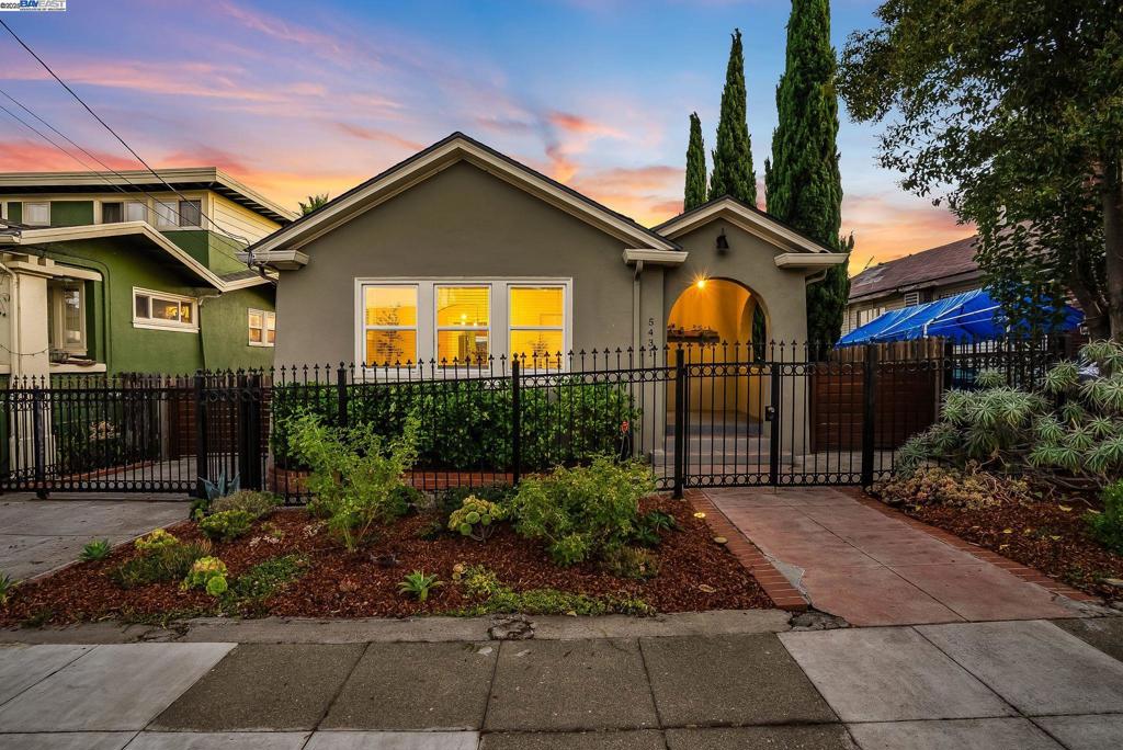 Welcome to 5431 Ygnacio Avenue — a charming Oakland home that blends classic character with modern upgrades. Step into a bright living room with original hardwood floors, modern lighting, and a stylish tiled fireplace. The formal dining room connects to the updated kitchen featuring two-tone shaker cabinets, quartz countertops, tile backsplash and stainless steel appliances. A sunny nook off the kitchen offers space for a breakfast area or home office overlooking the spacious backyard. The home includes three comfortable bedrooms and two full bathrooms with custom tile finishes. Enjoy the outdoors on the 5,625 sq ft lot with a lush lawn, planter beds, and a sunken seating area—perfect for entertaining. A long driveway provides parking for multiple vehicles, a boat, or RV. Energy-efficient solar panels add to the home’s appeal. Move-in ready with timeless style and thoughtful updates throughout.